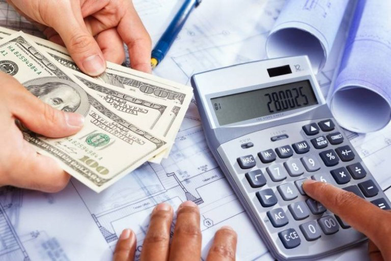 Image showing cost for a project being calculated using a calculator