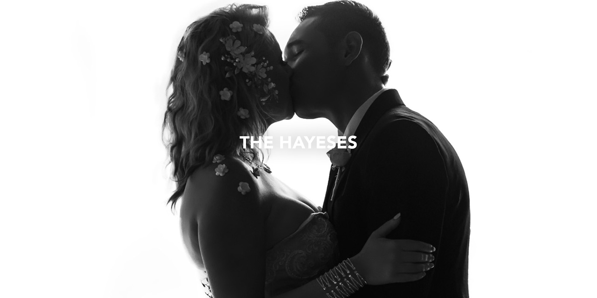 wedding couple bride and groom kissing in a silhouette photograph black and white photographed by black rock studio 