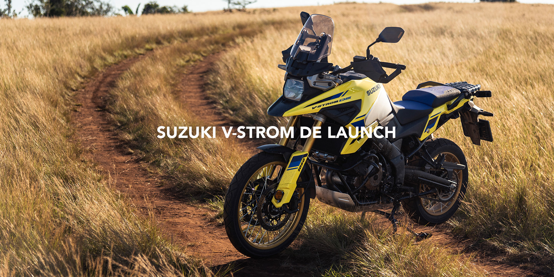 Suzuki V-strom 1050 DE yellow adventure motorcycle photographed on a jeep trail in a field on a mountain at sunset by black rock studio for suzuki south africa for the local launch of the new de 1050 v-strom