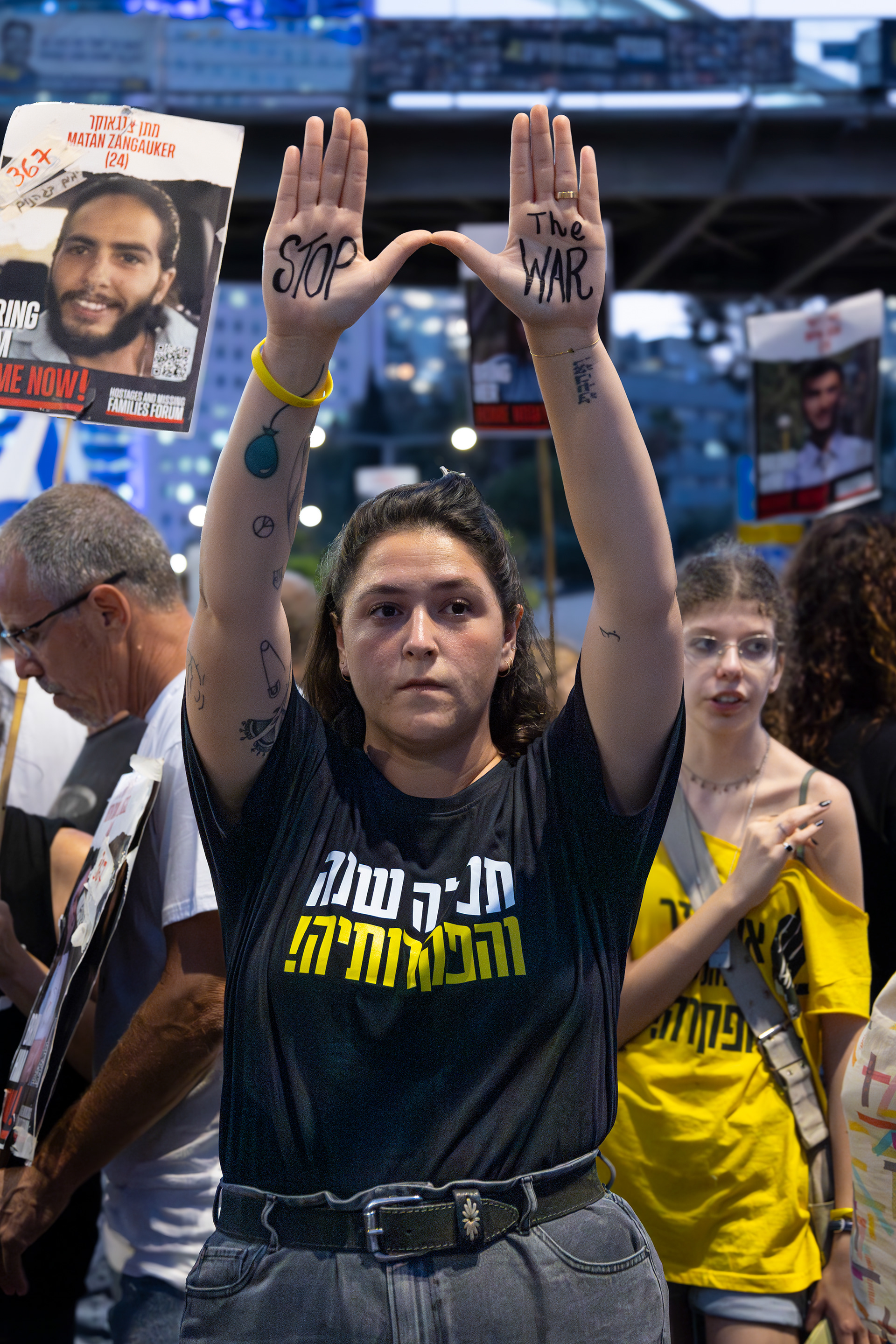 A protester in Tel Aviv displays her hands, which read ‘Stop the war,’ during a demonstration calling for the return of the hostages.