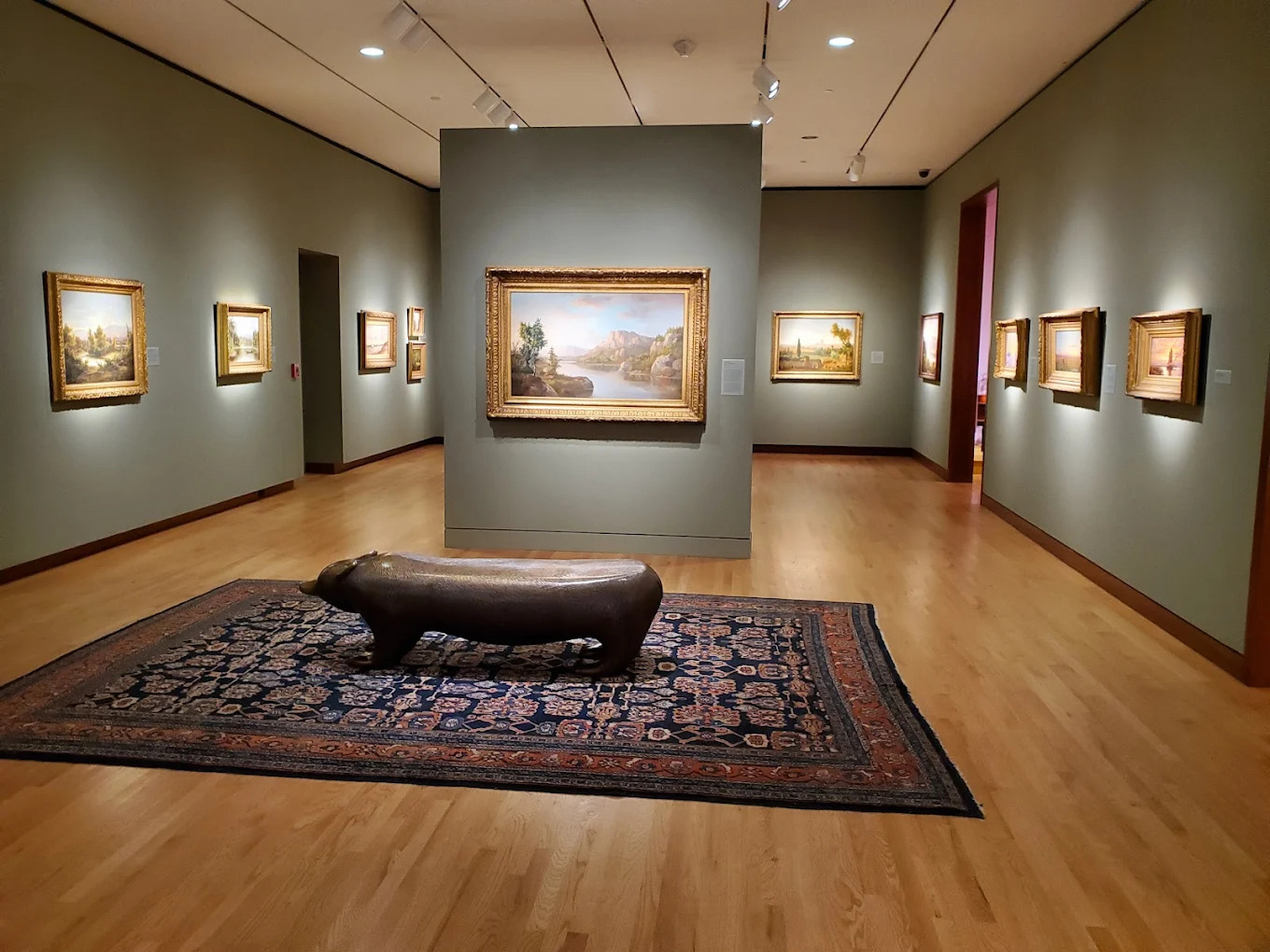 Shows a gallery art space of American Art.