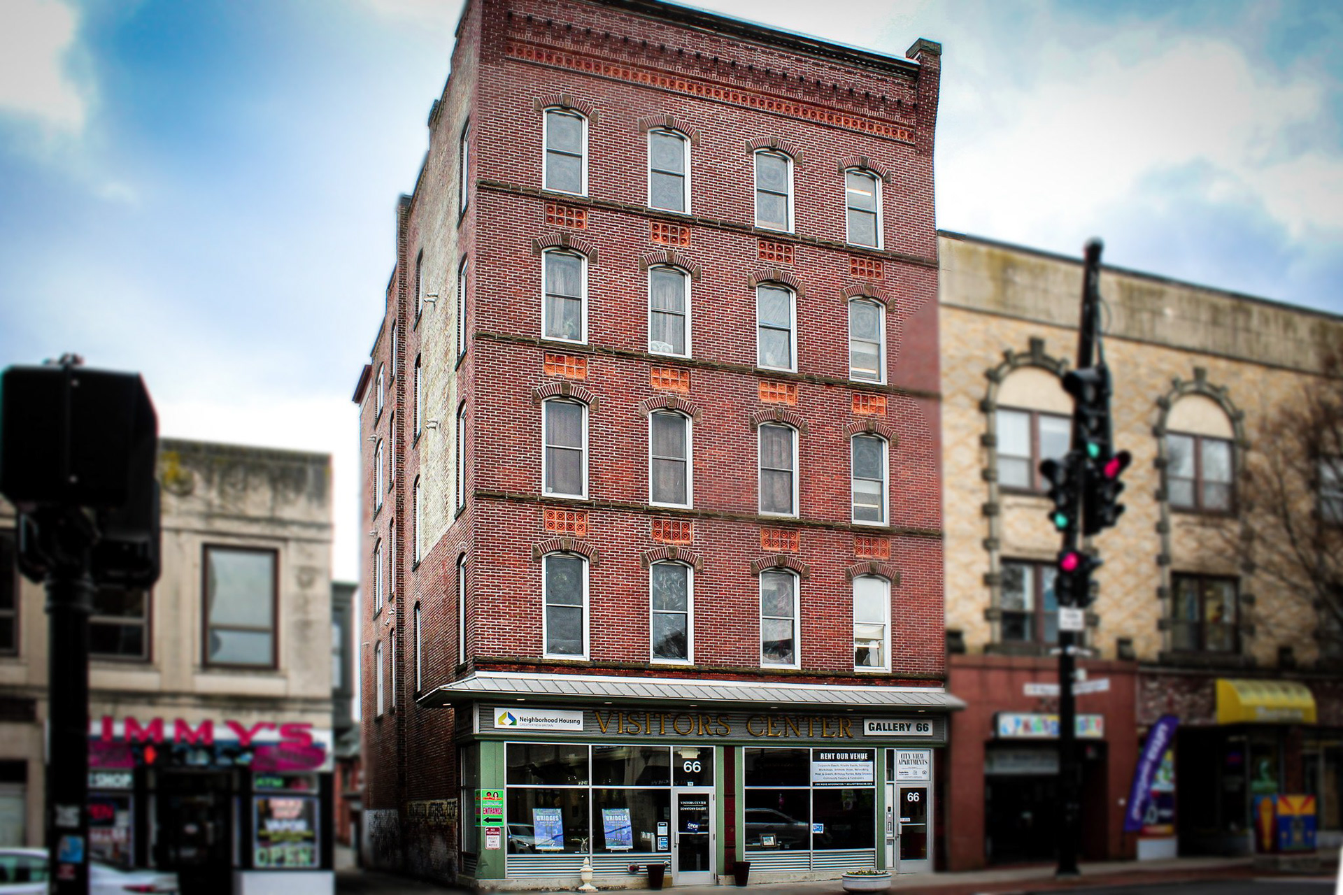 Shows a red brick building of New Britain's Gallery 66 and Visitor's Center.
