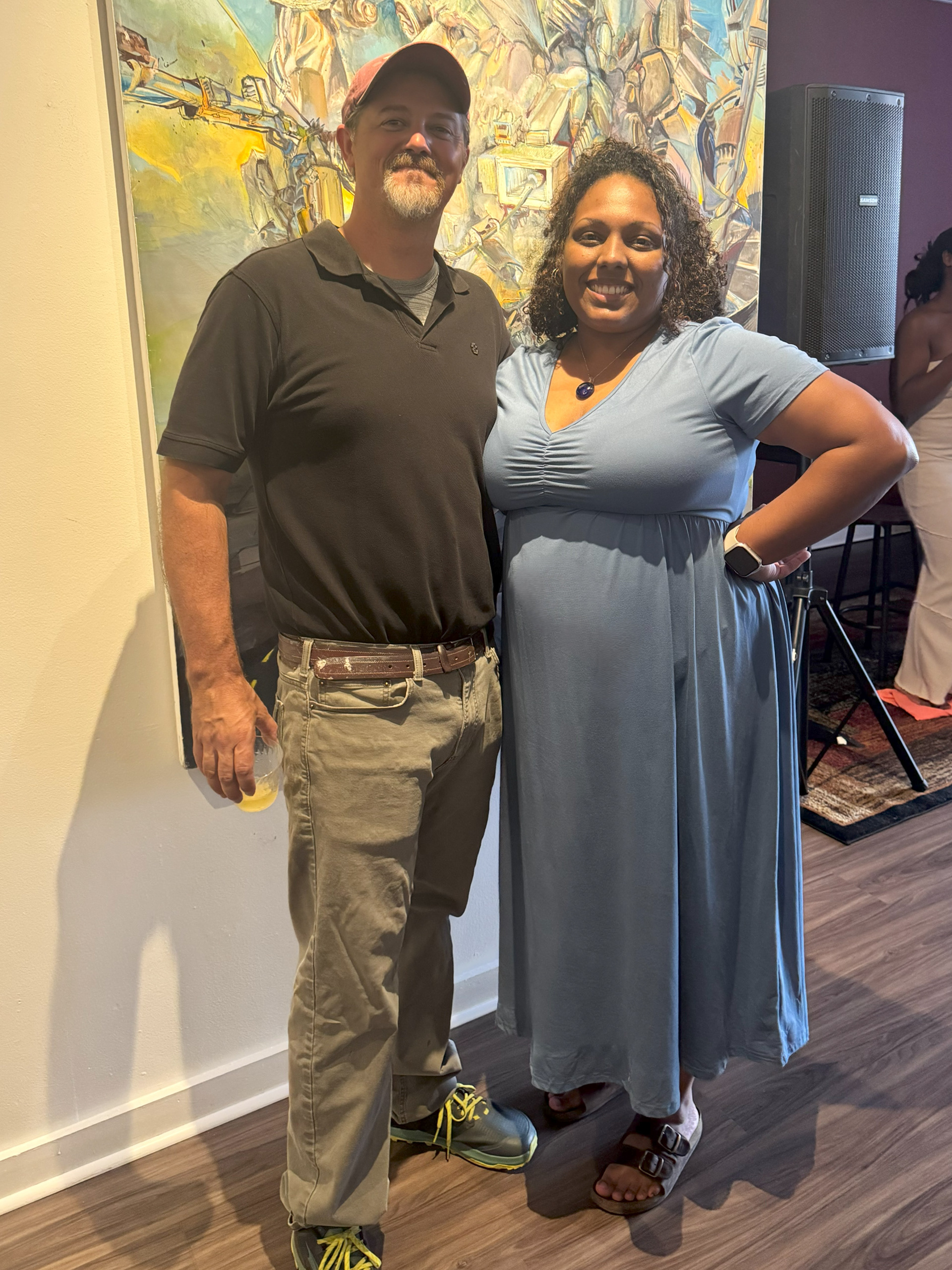 Chris Gann, the artist, posing with me for a picture in front of his painting.