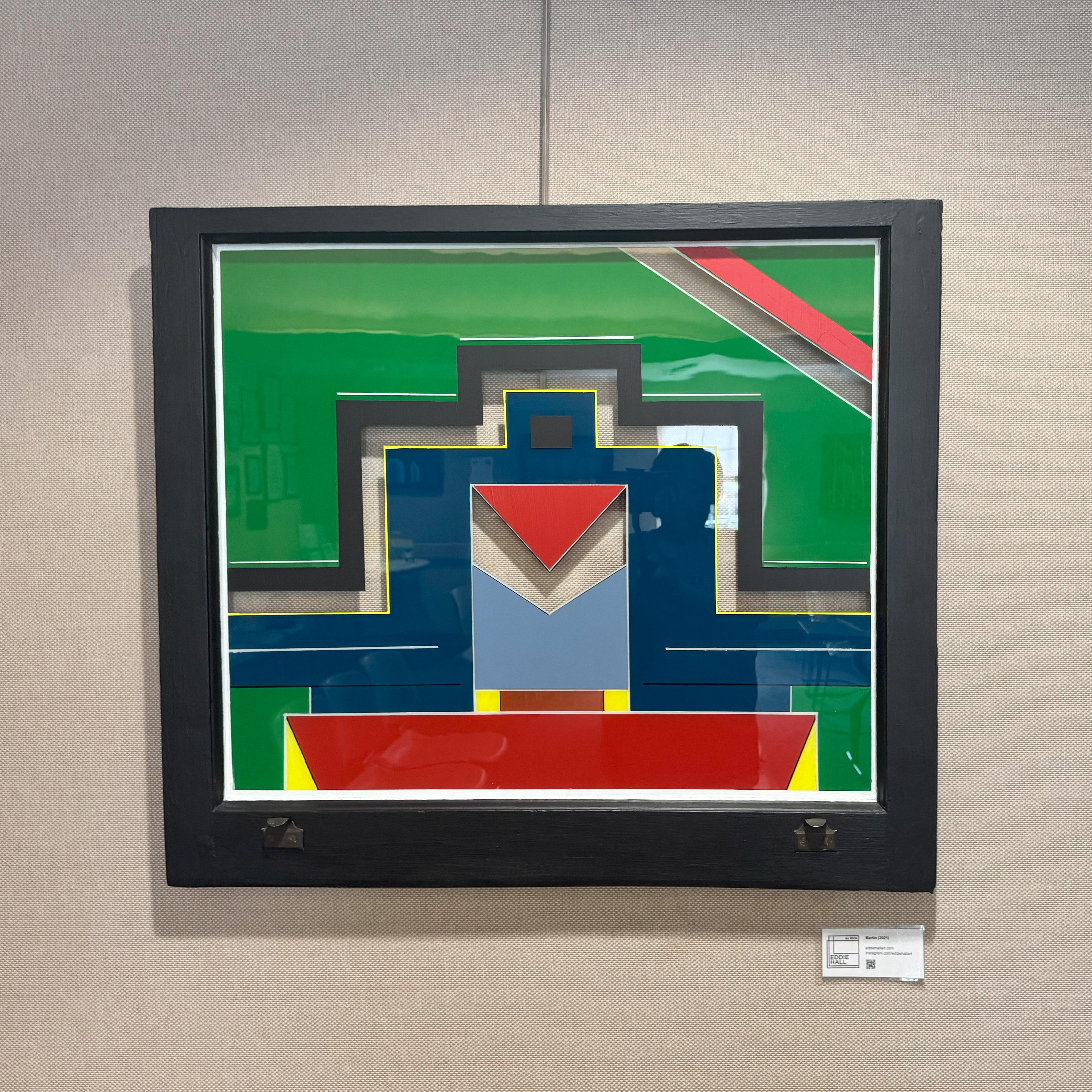 Shows a green, red and blue artwork of Eddie Hall.