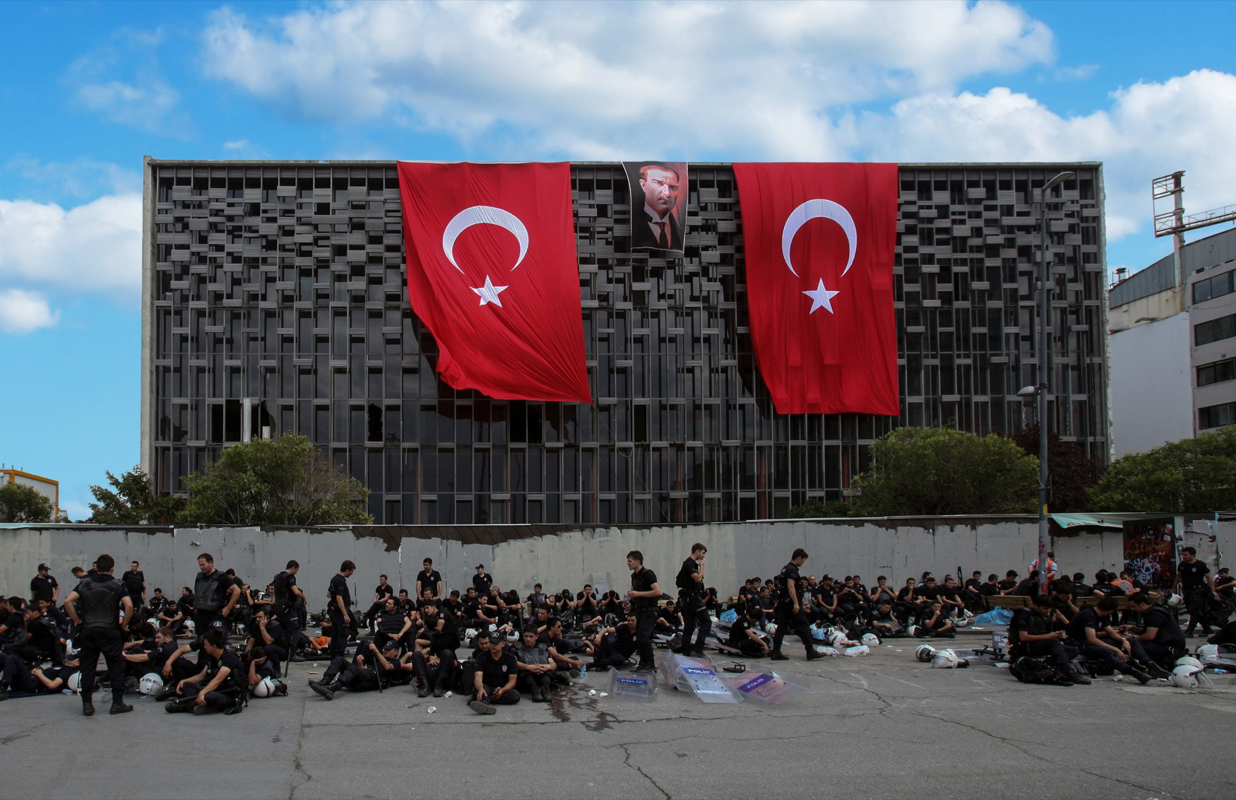 Policemen rest in front of Ataturk Cultural Centre (AKM), İstanbul, 2013