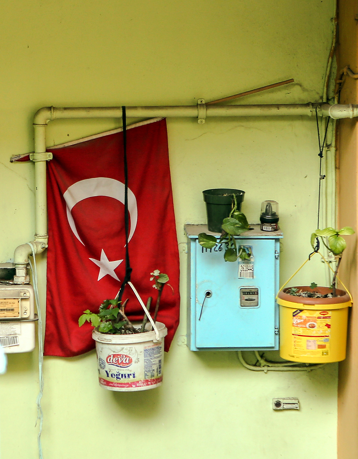 A flag ready for a ceremony in the entrance of an apartment, İstanbul, 2015