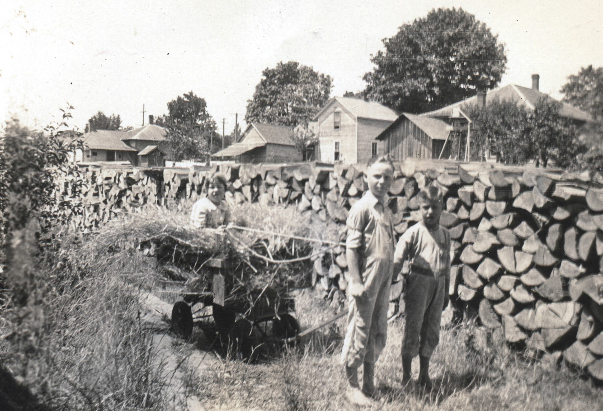 Red, Ned, and Margarite in front of their house in Philomath.