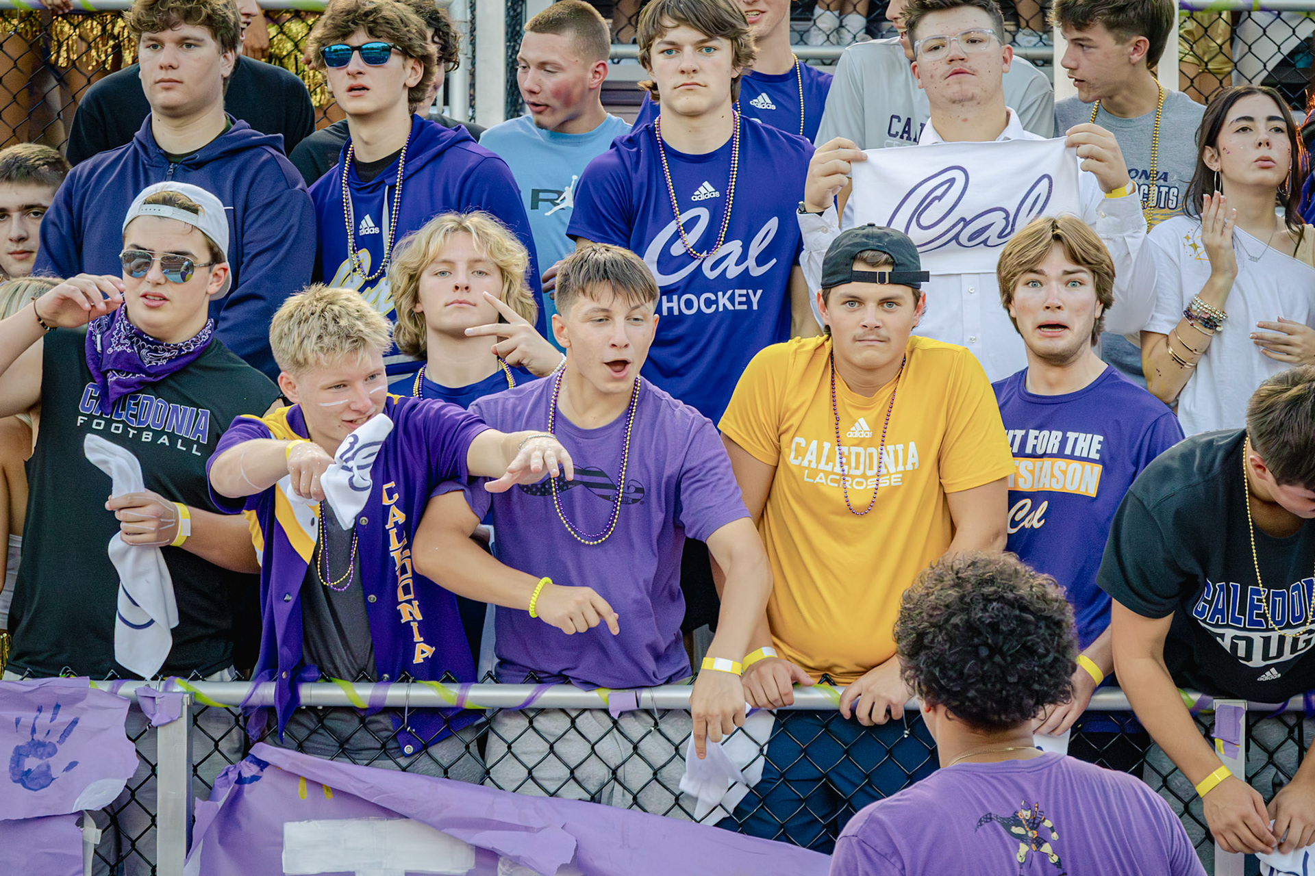 HOMECOMING Sergio and Joseph greet Isaiyah Supuk before the big game. (Photo by Taya Penoes)