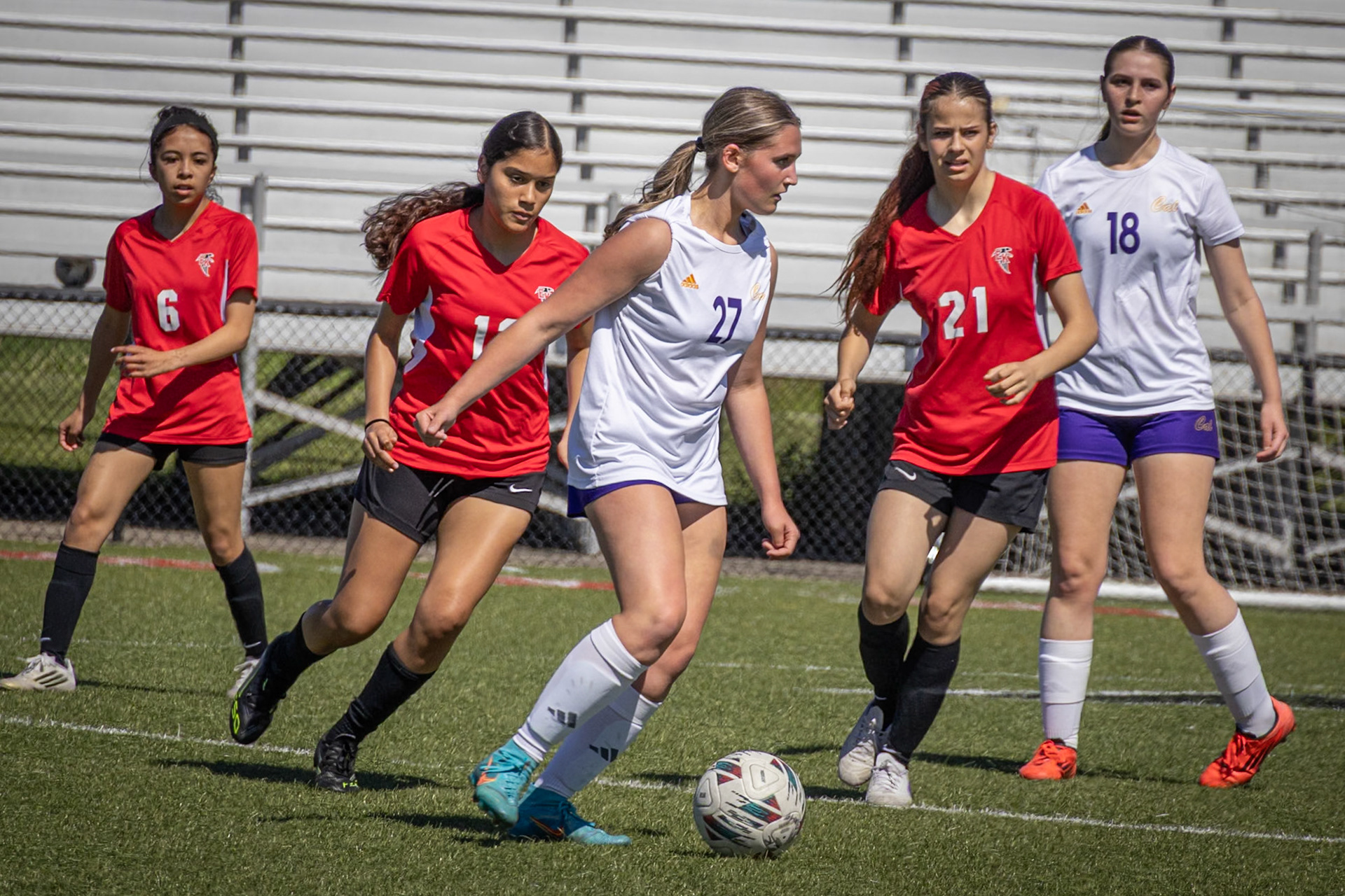 Freshman Reese Krieger prepares to take the ball to the goal. (Photo by Eva Sierra)