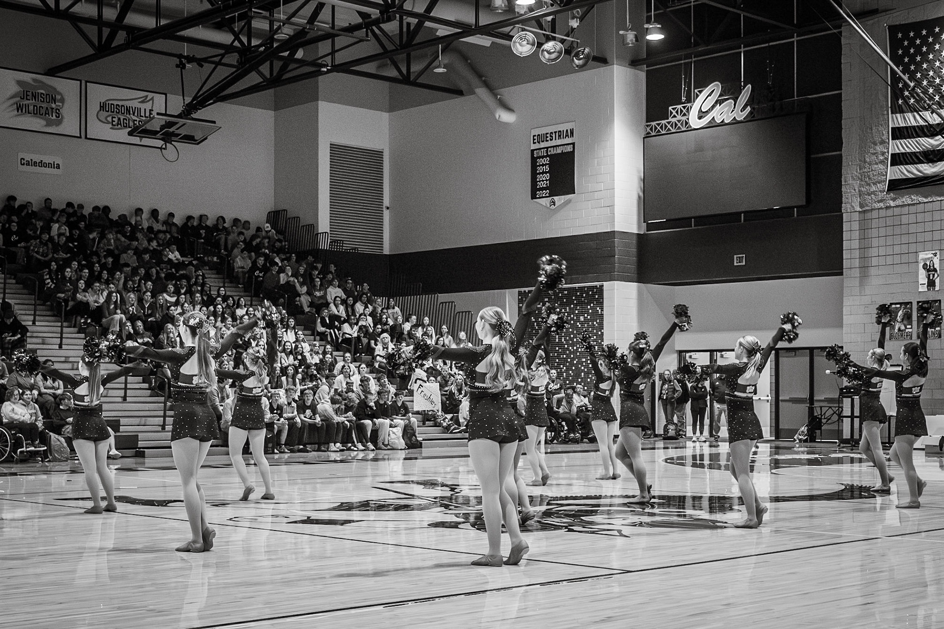 For the final time during the 2025–2026 season, the Caledonia Varsity Dance Team performs its pom routine, “I Love Me,” as students watch from the bleachers. (Photo by Abby Skibinski)
