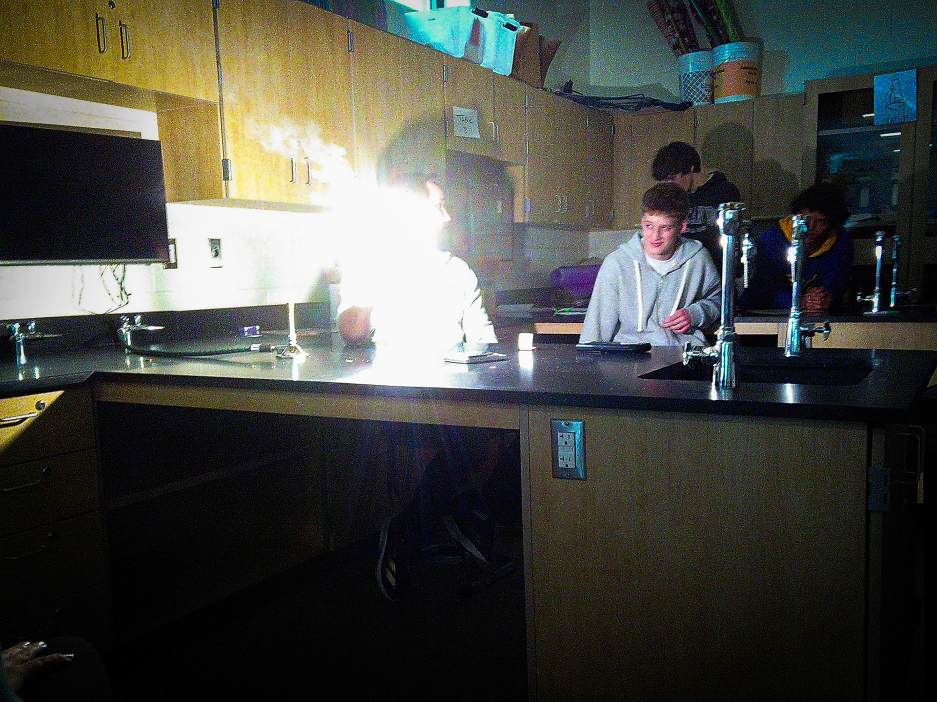 Bringing the lesson to life, Mr. Durkee shows how metals react when exposed to heat in chemistry class. (Photo by Elise Clarin)