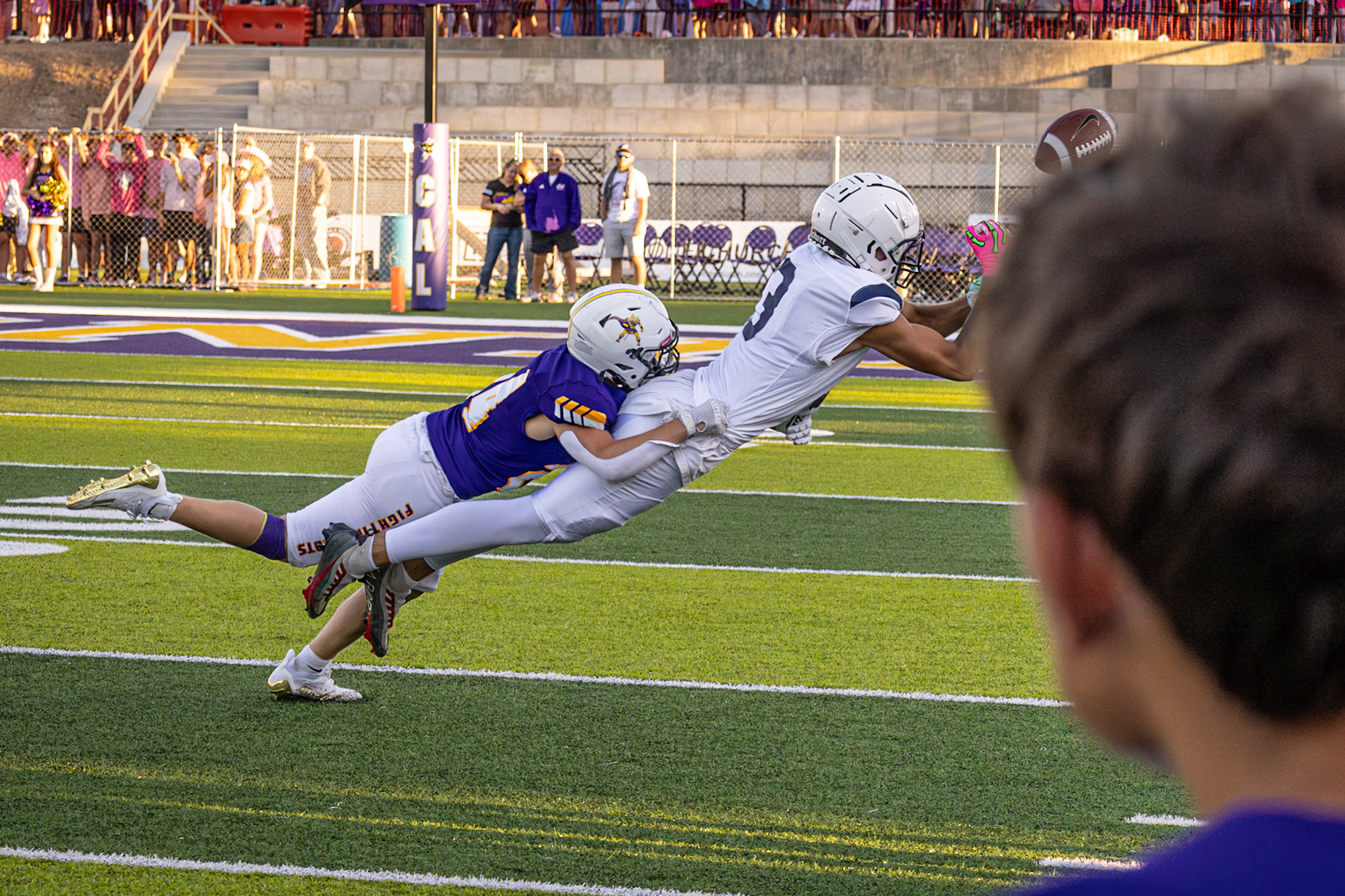 A desperate dive for the ball as defense and determination collide. (Photo by Egan Otto)