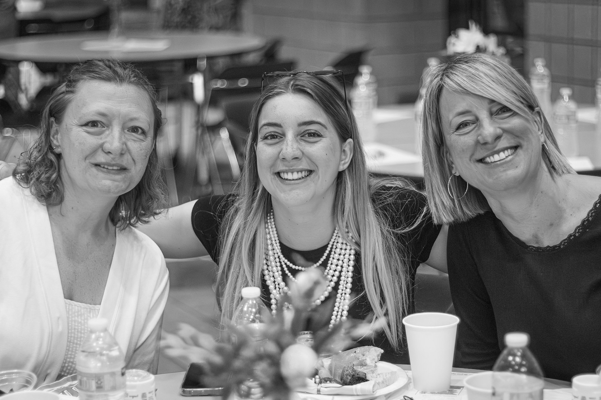 Marie Bozso shares laughs and hugs with her host mom and her mom, who traveled from France for a heartfelt reunion. (Photo by Elsha Bytwork)