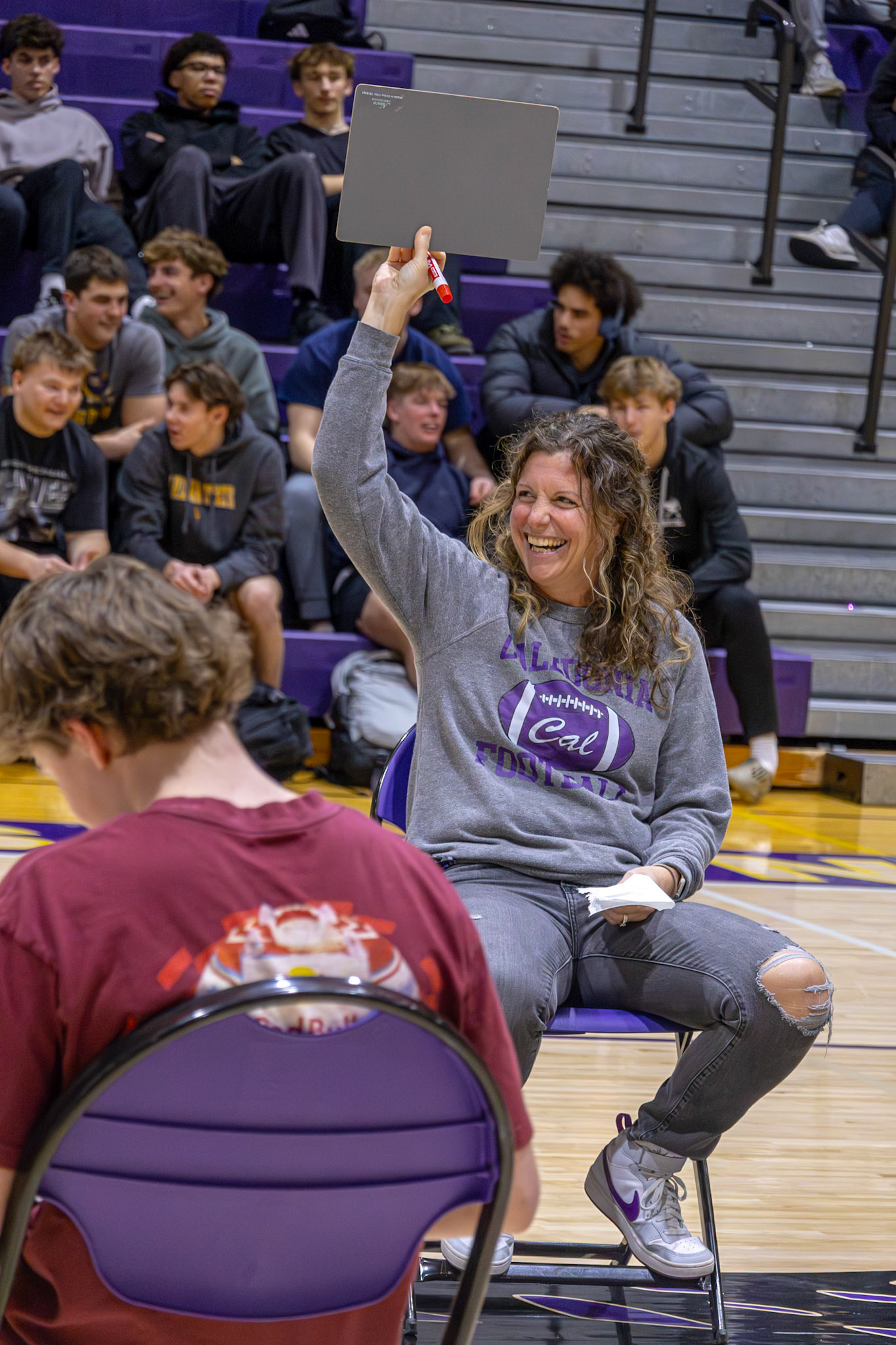 Mrs. Uyl shows her playful side during the Gen Z vs. Millennial game, keeping the laughs going. (Photo by Lilli Jackson)