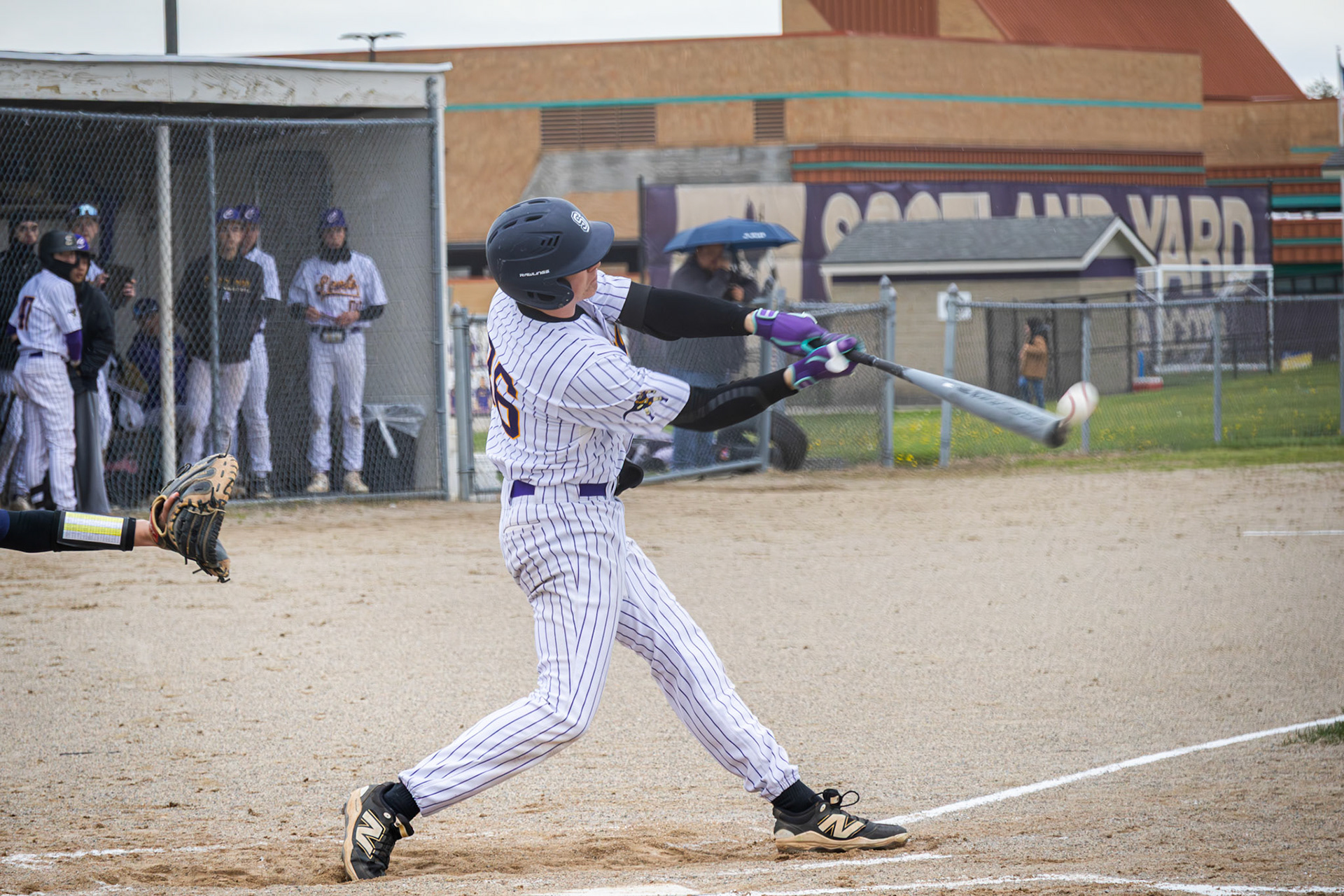 Evan Crater makes contact. (Photo by Emma Garza)