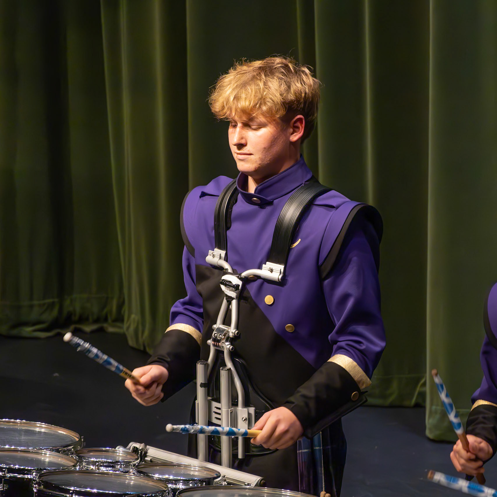 Jackson Pugh anchors the percussion line with a high-energy performance on the drums. (Photo by Molly Larson)