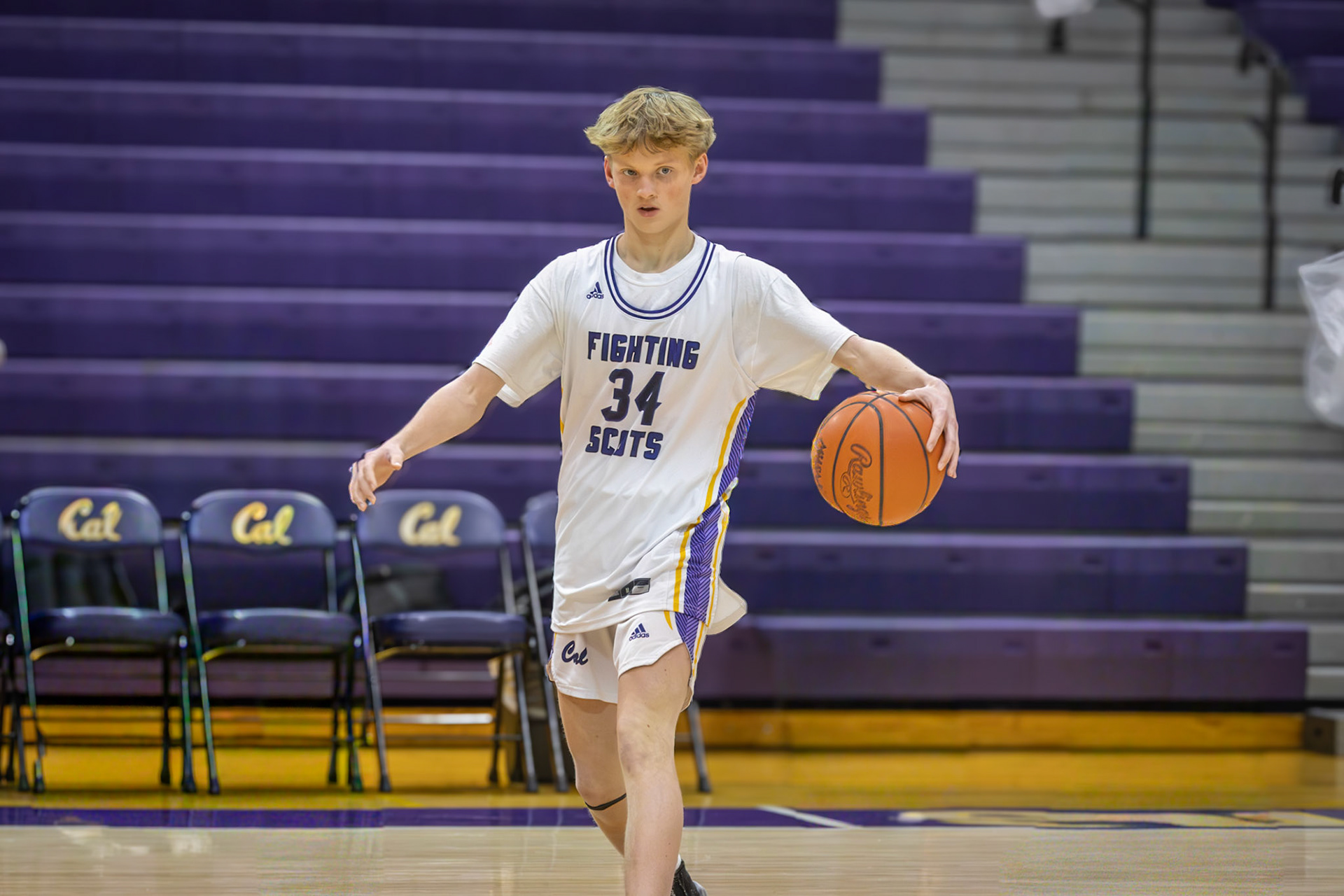 Freshmen Tyler Cawthorne wams up, ready for the game. (Photo by Thomas McKee)