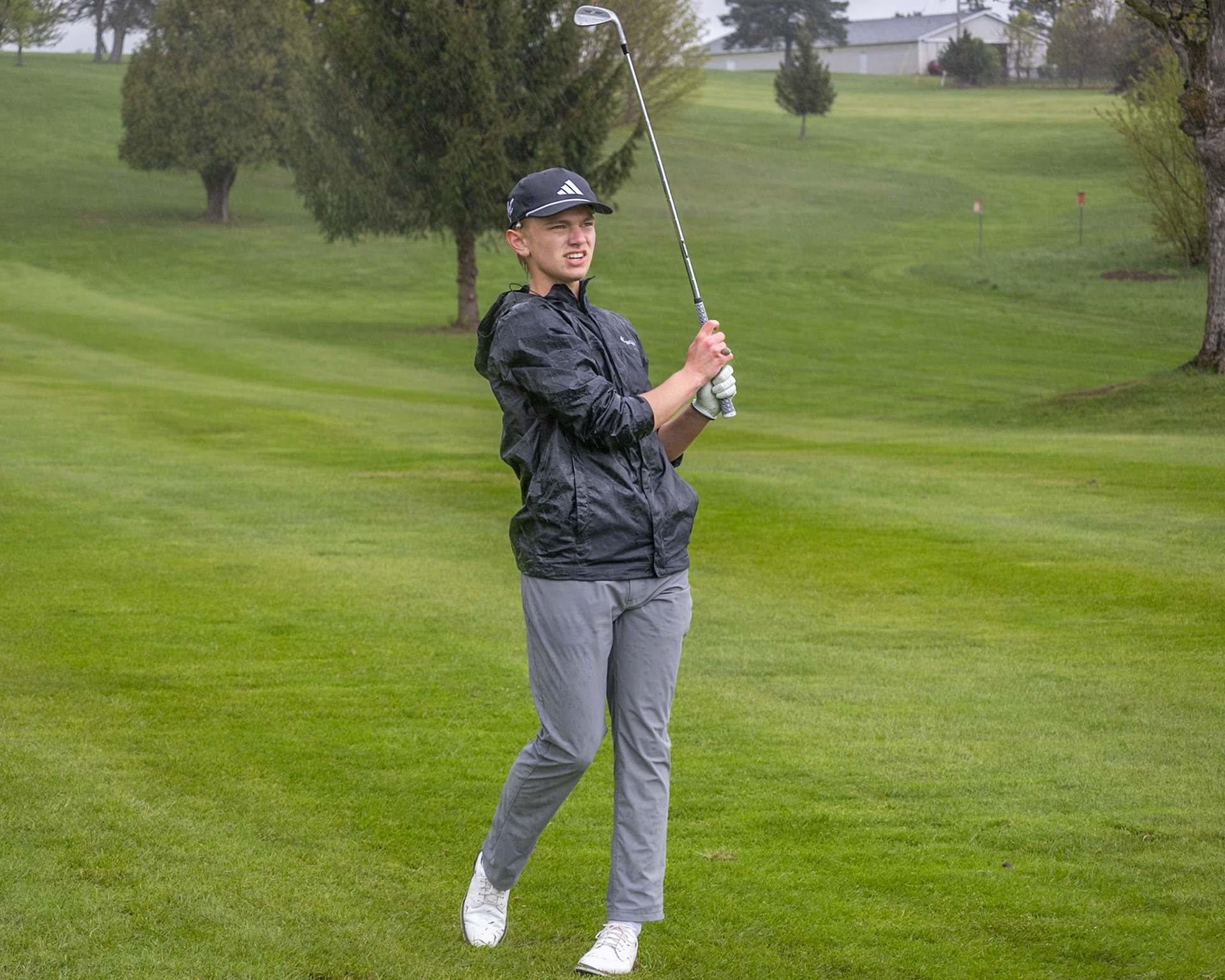 After a strong swing, Anderson Collins watches his shot drift down the fairway toward the green. (Photo by Emma Garza)