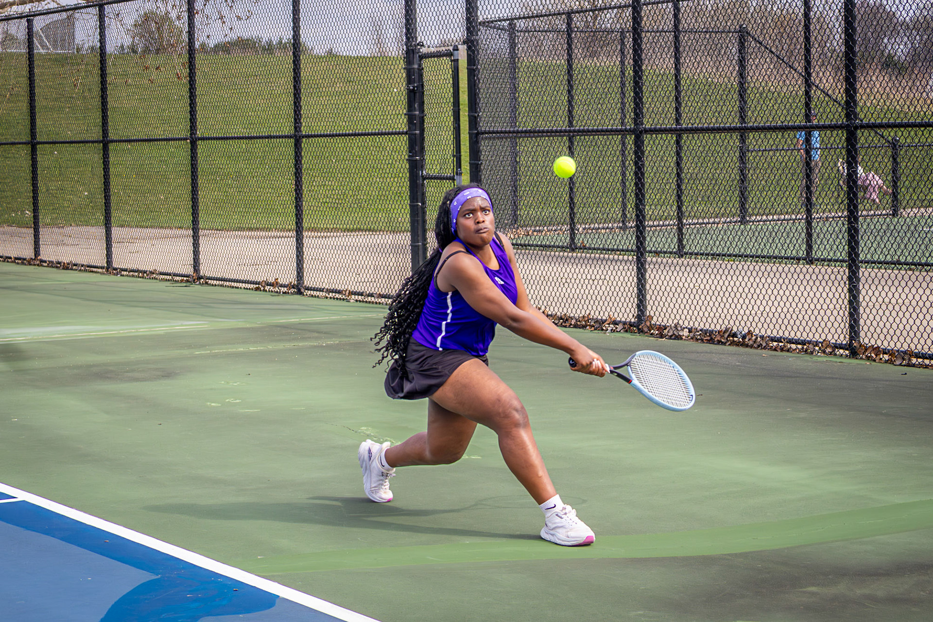 Helena Truong drops low and stays balanced, meeting the ball with focus and a quick, controlled return. (Photo by Hailey Thayer)