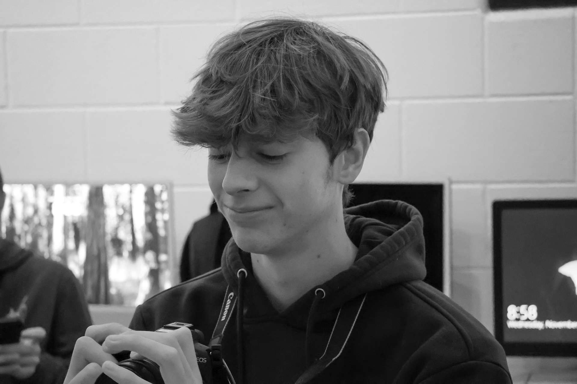 Nik VanderArk readies his DSLR for the next shoot in Digital Art &amp; Photography class. (Photo by Ashlyn Nichols)