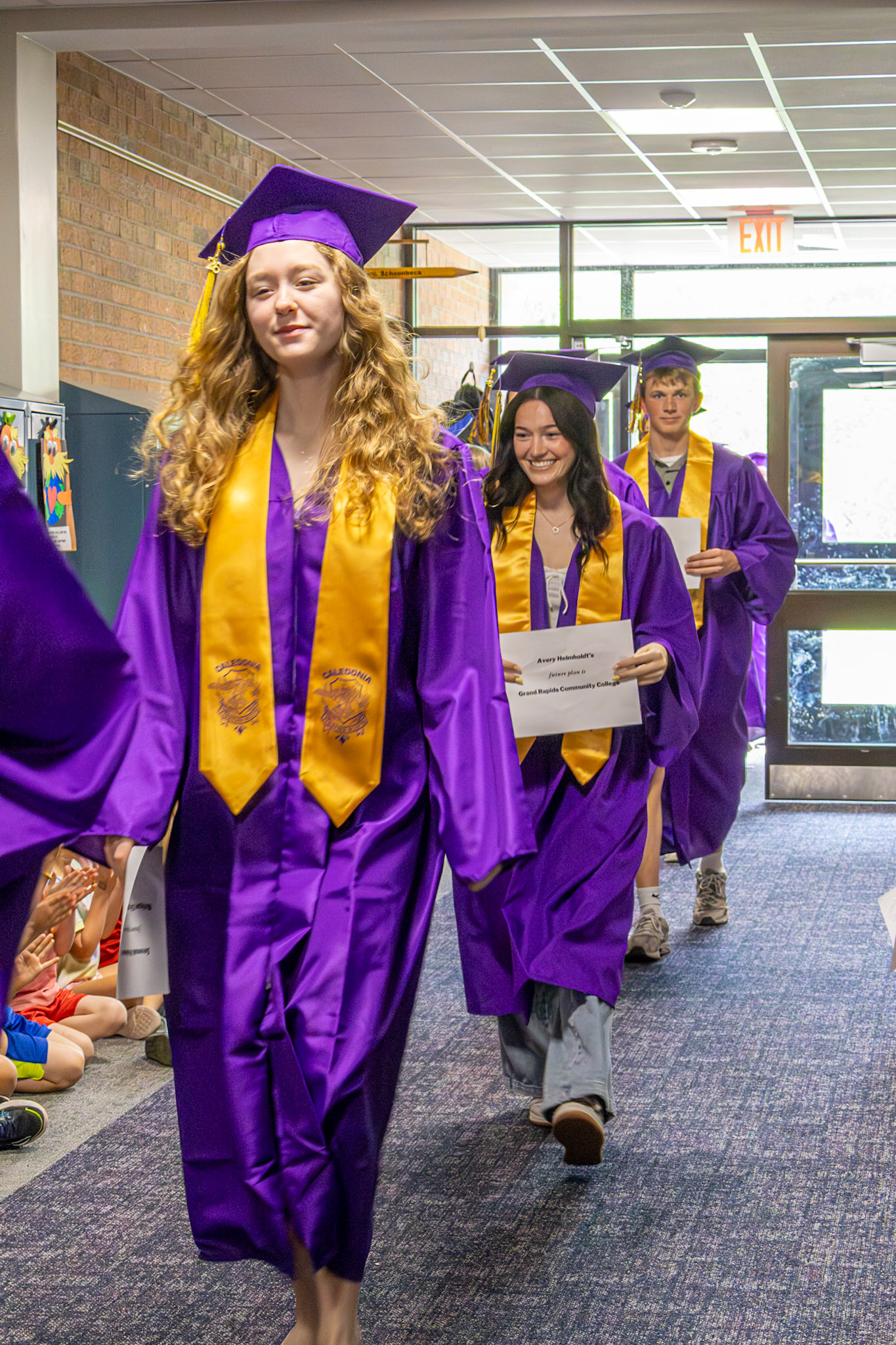 Savannah Robinson, Avery Helholdt, and Noah Kaplan walk through cal el one last time. (Photo by Sophie Grajewski)