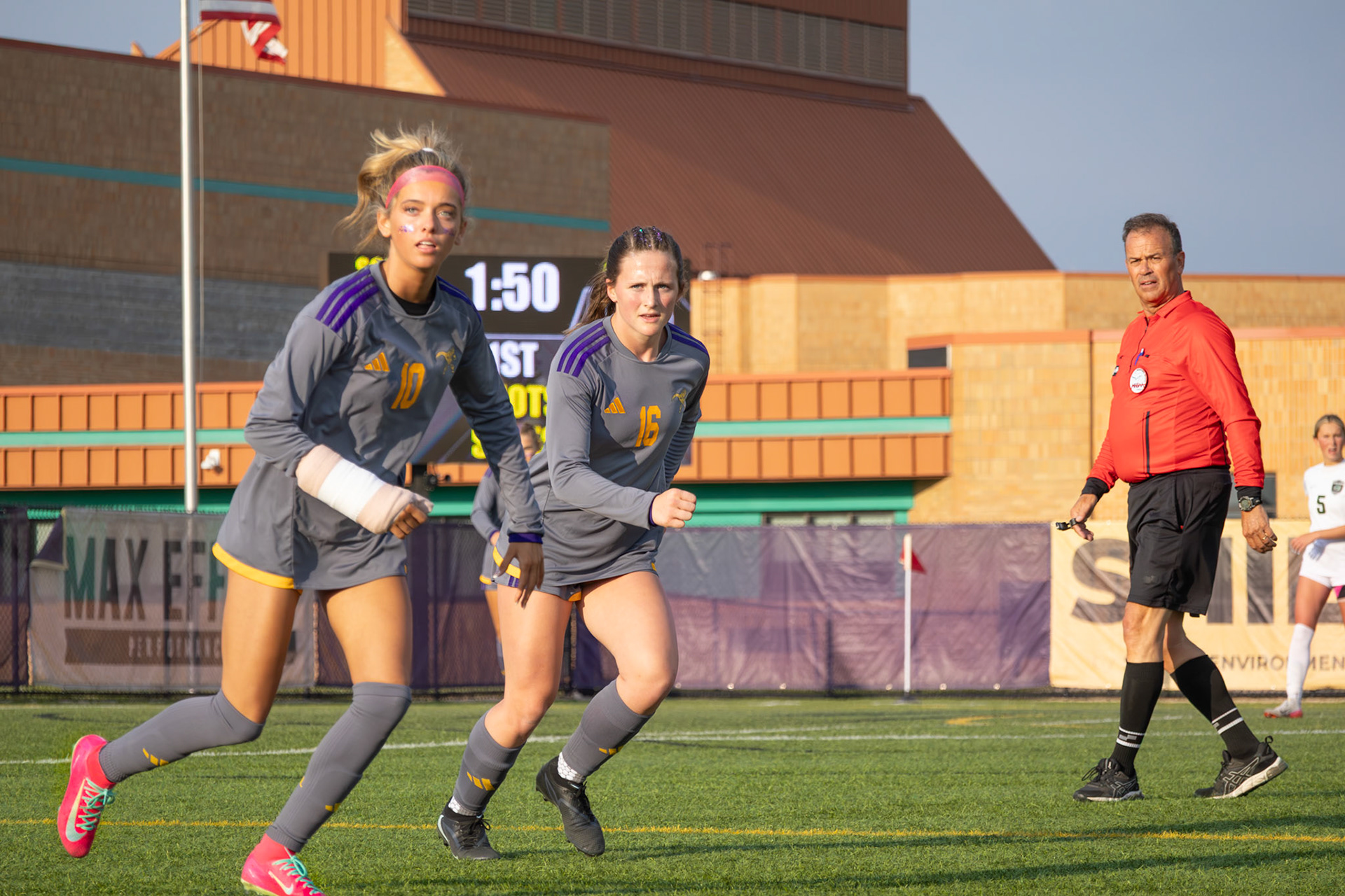 Maya Terryn races down the field alongside her teammate, both tracking the ball and chasing the play. (Photo by Ava LaBine)