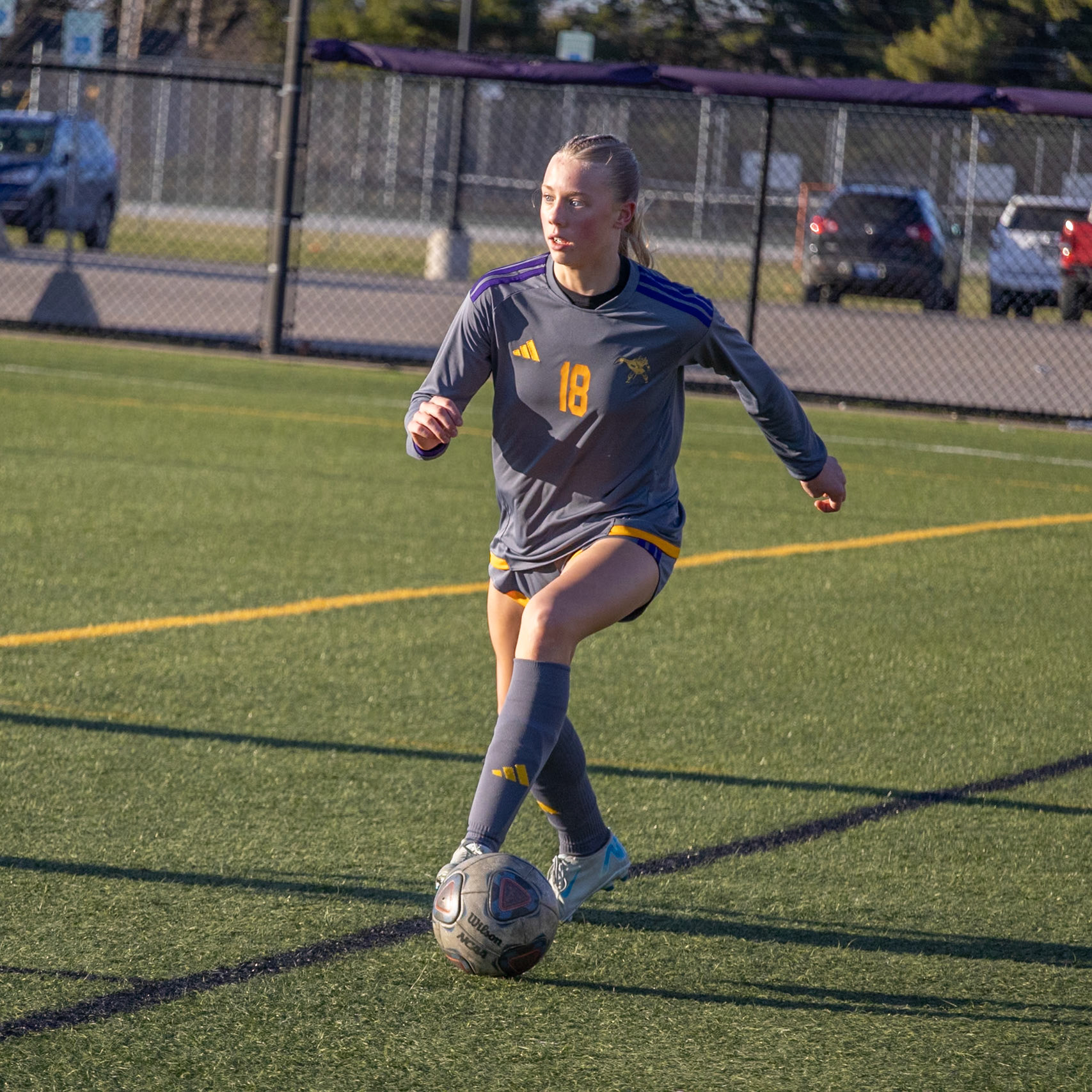 Freshman Reese Abbott pushes the ball downfield to clear it away from her goalie. (Photo by Rhyan Guzman)