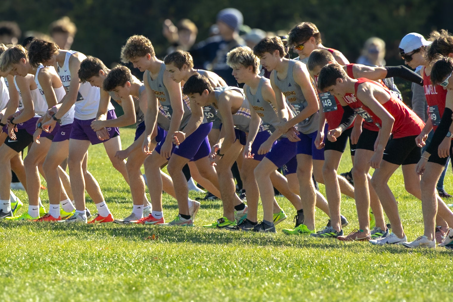 The Caledonia boys cross country team lines up at the regional start line, aiming for a top-three finish and a trip to the state meet. (Photo by Elise Clarin)