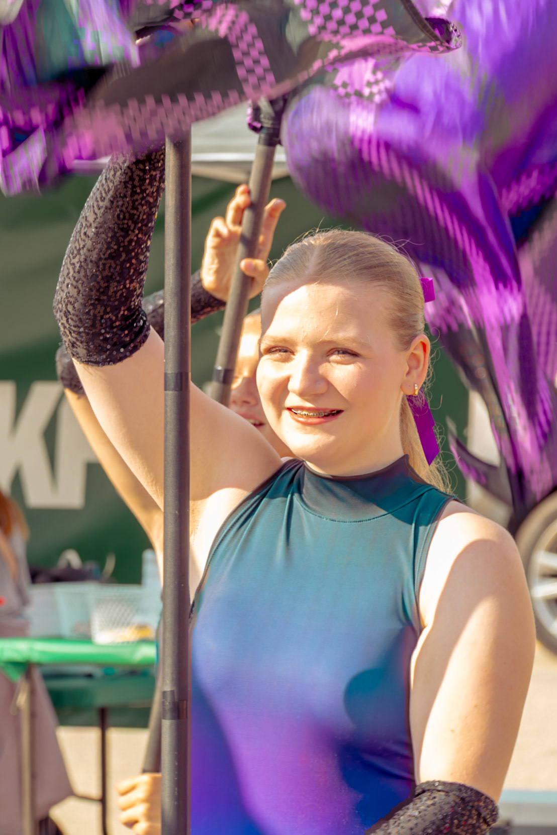 CELEBRATE IN STYLE Junior Olivia Norberg honors the moment with grace and precision, bringing energy, pride, and elegance. (Photo by Kayley Martin)