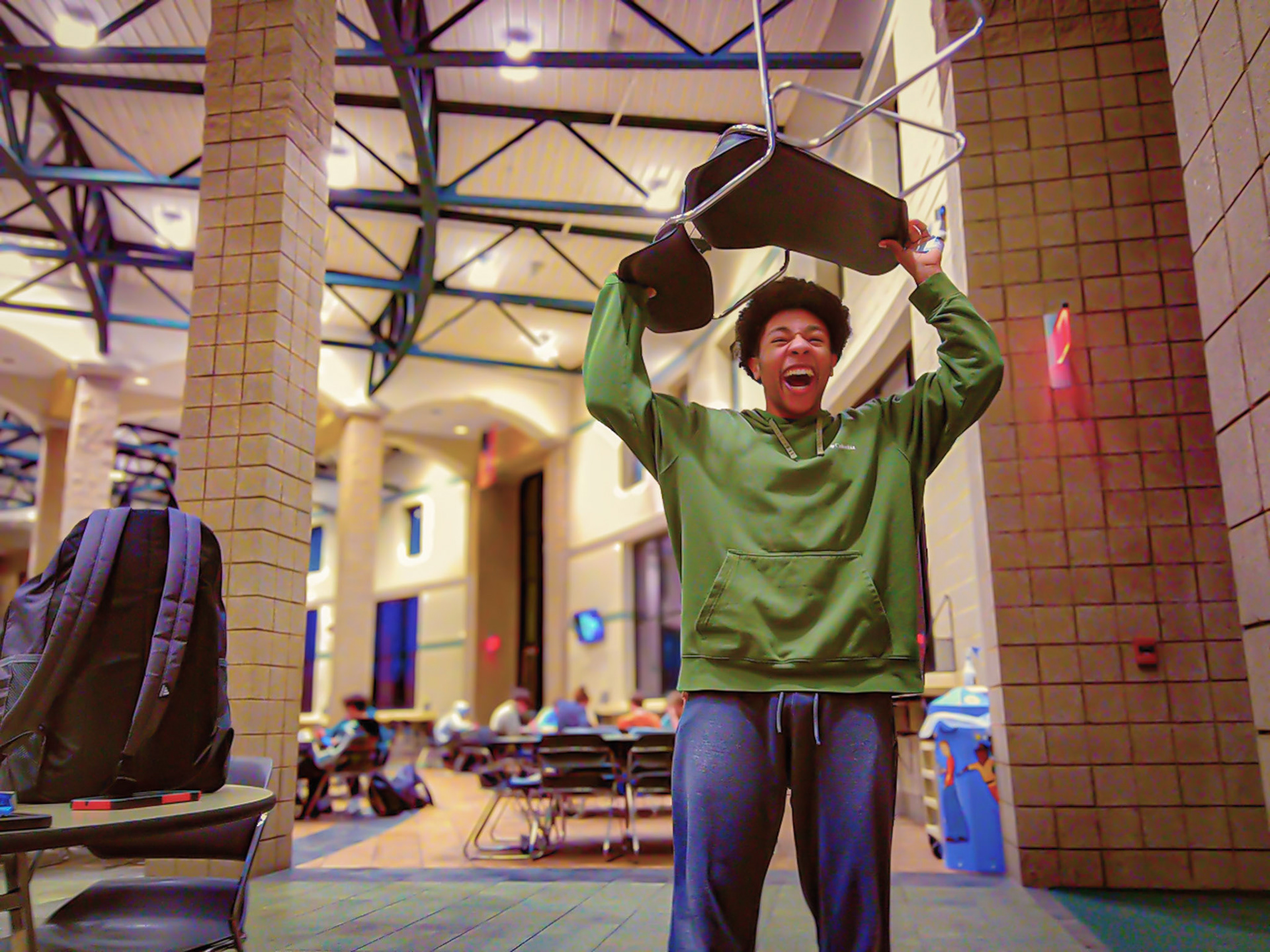 Jacob Dunn holds a chair over his head because he is a Barbarian. (Photo by Joseph Dunn)
