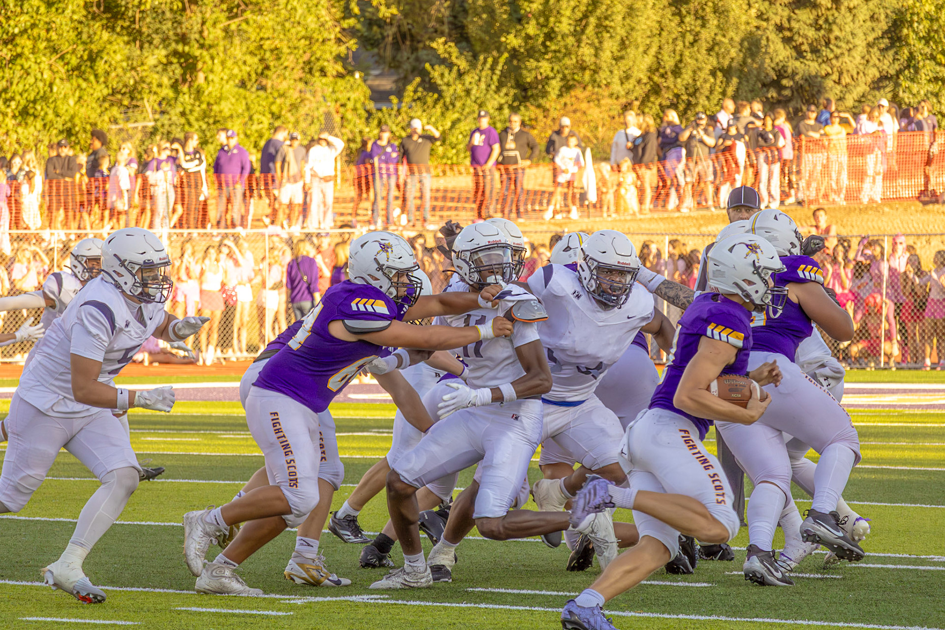 Cal’s running back drives forward through traffic, pushing for extra yards as defenders close in.(Photo by Egan Otto)