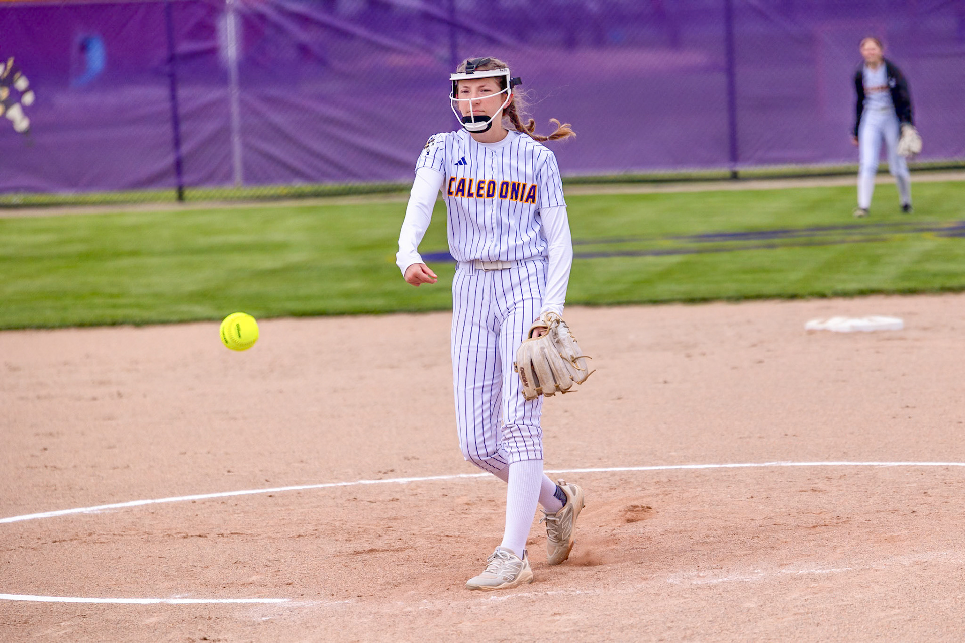 Addyson Olin delivers another pitch from the circle during a win against Muskegon. (Photo by Landry Mueller)