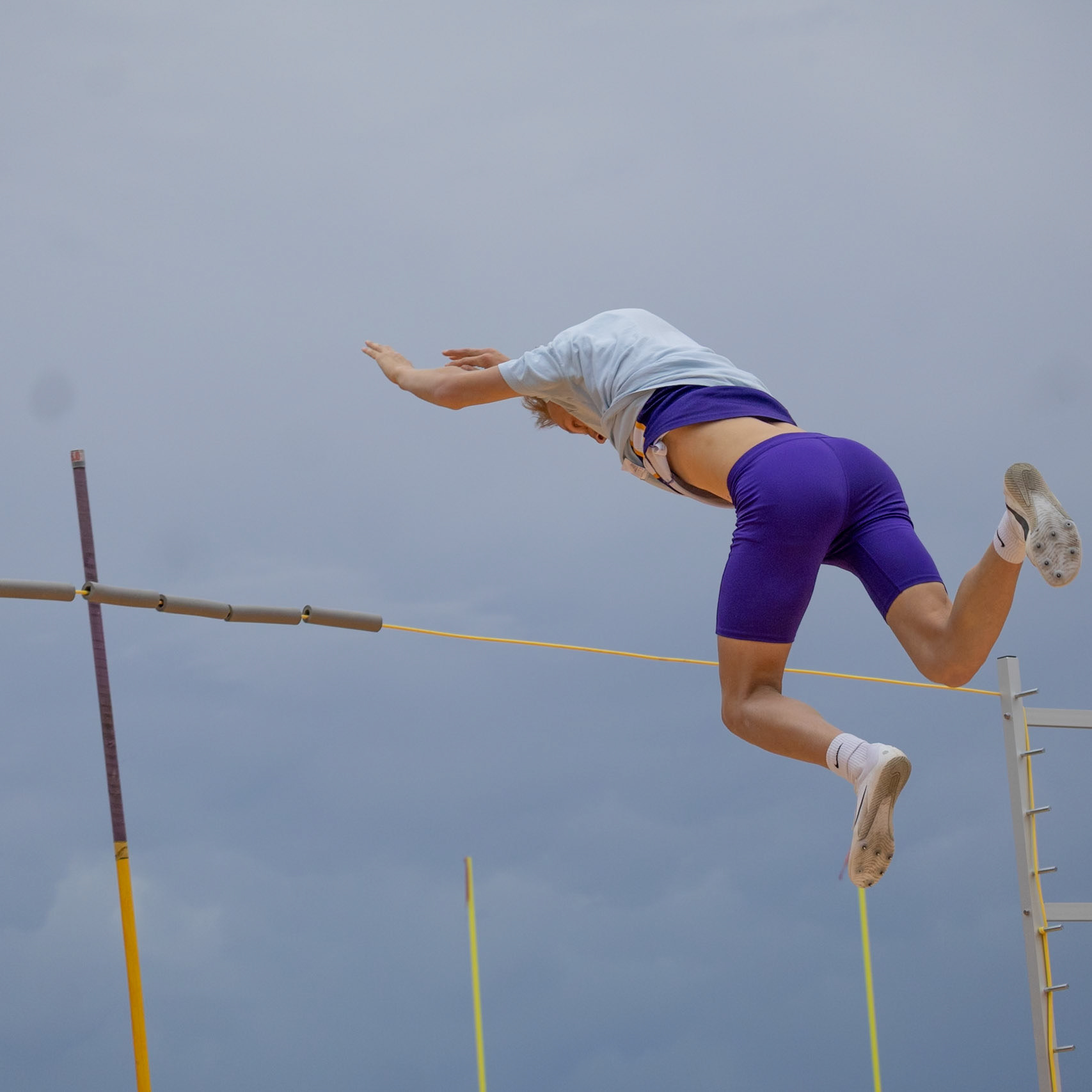 Cohen Bloem gets some practice jumps in before pole vault starts. (Photo by Justin Harper)
