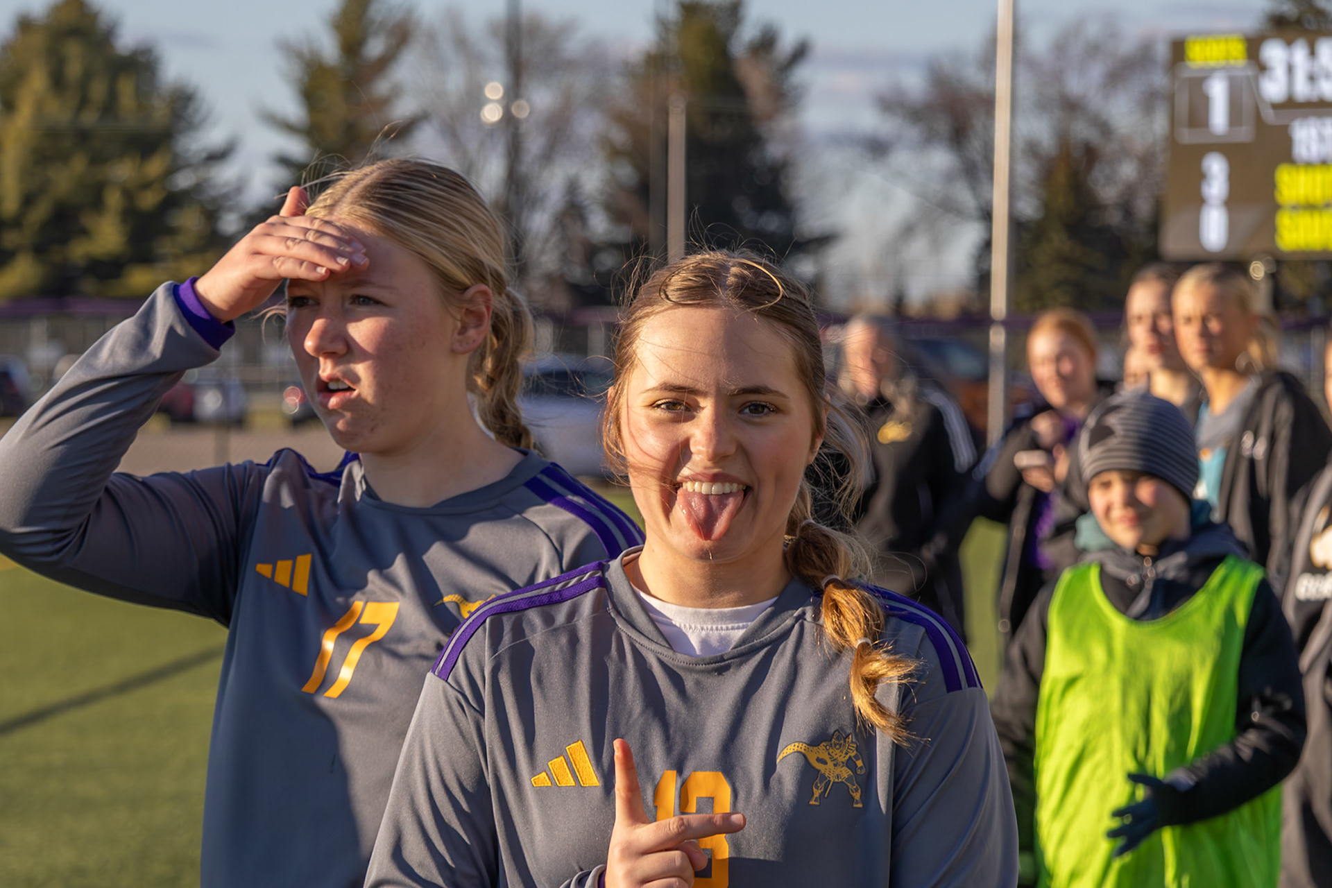 Mady Mulder reacts on the sideline as Emily Walbeck stays focused on the action. (Photo by Rhyan Guzman)