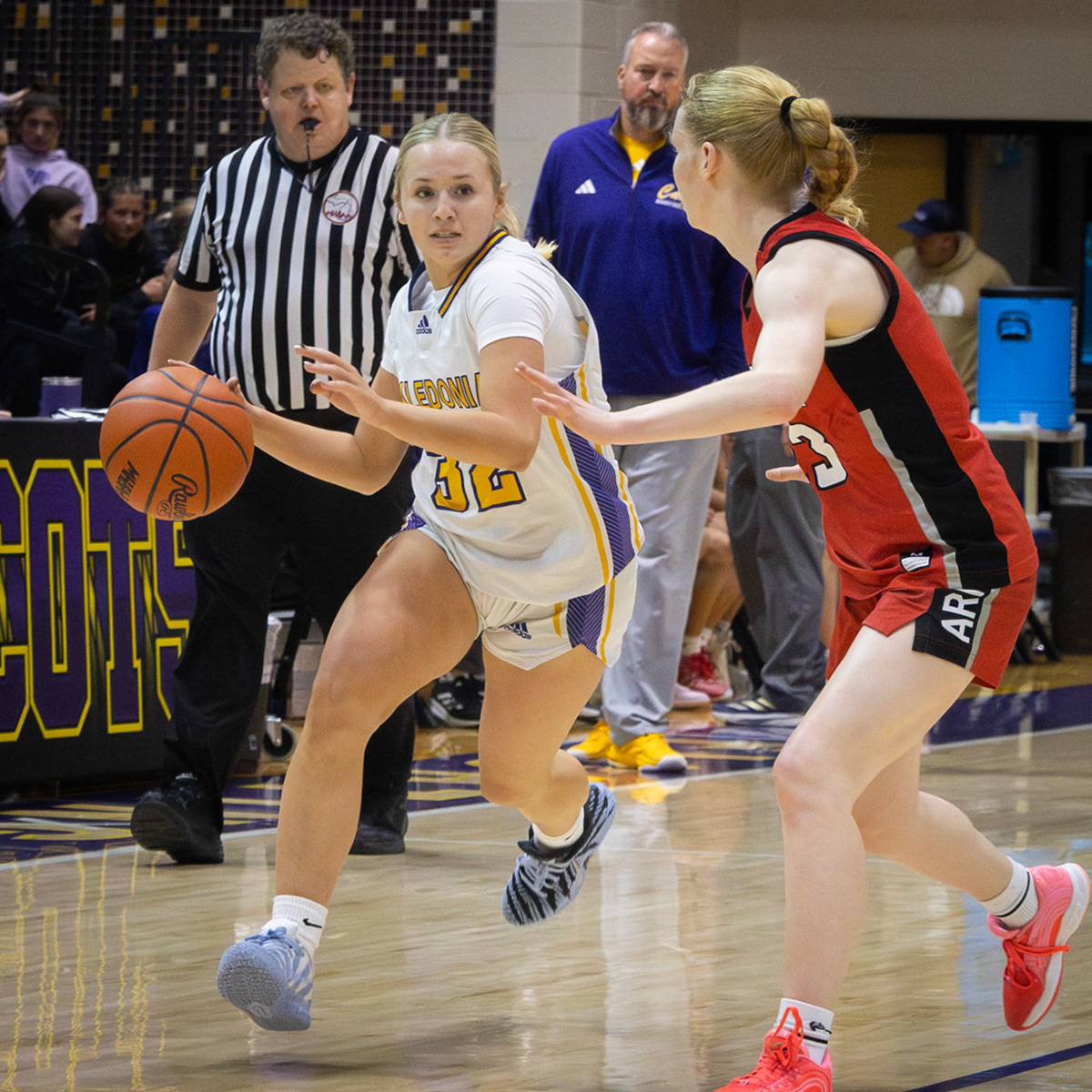 Remy Meyer attacks the basket for the Scots. (Photo by Landry Mueller)