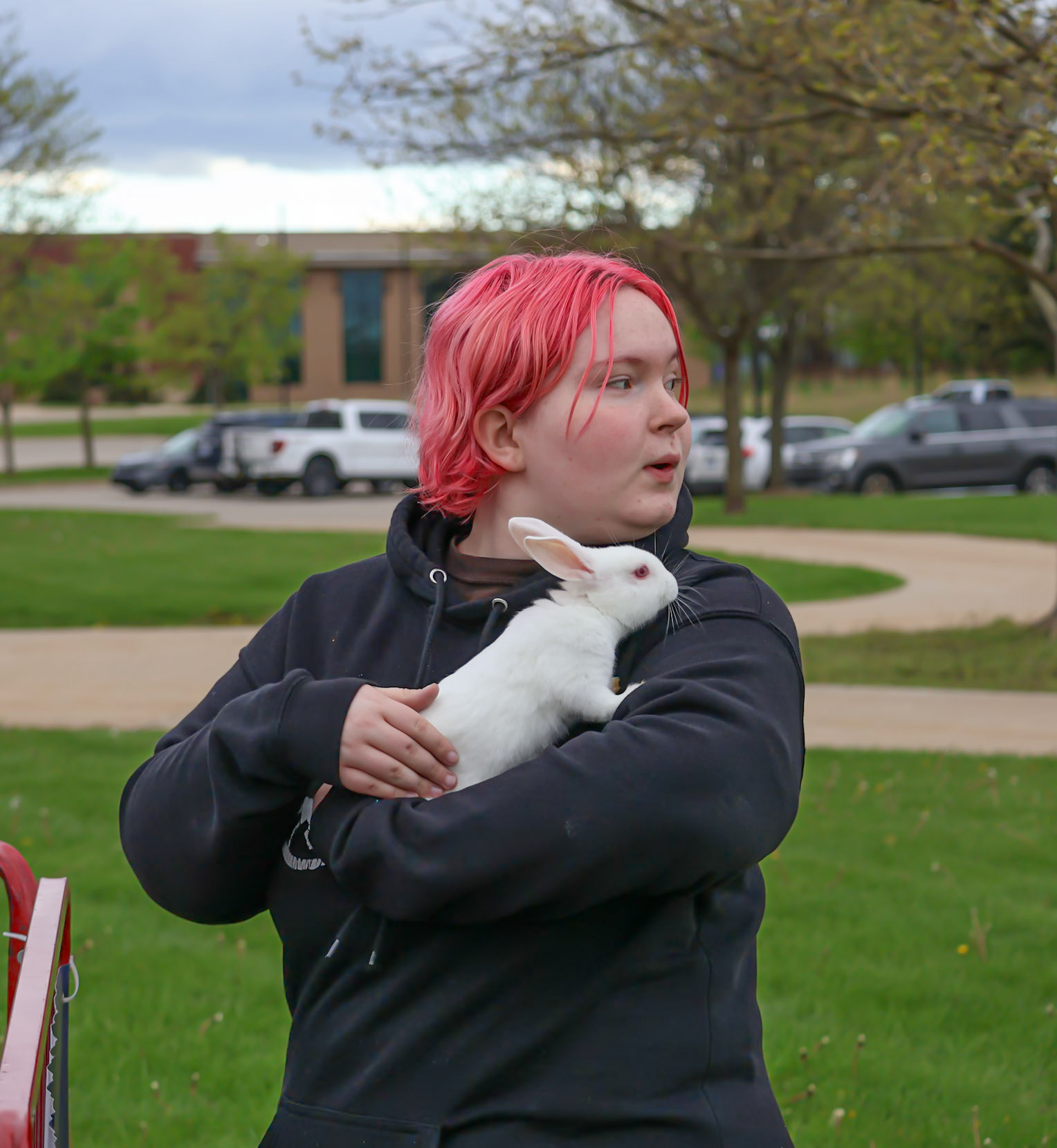 Madyson Randall holds a bunny at the petting zoo, enjoying one of the many activities at the Spring Carnival. (Photo by Brianna Severson)