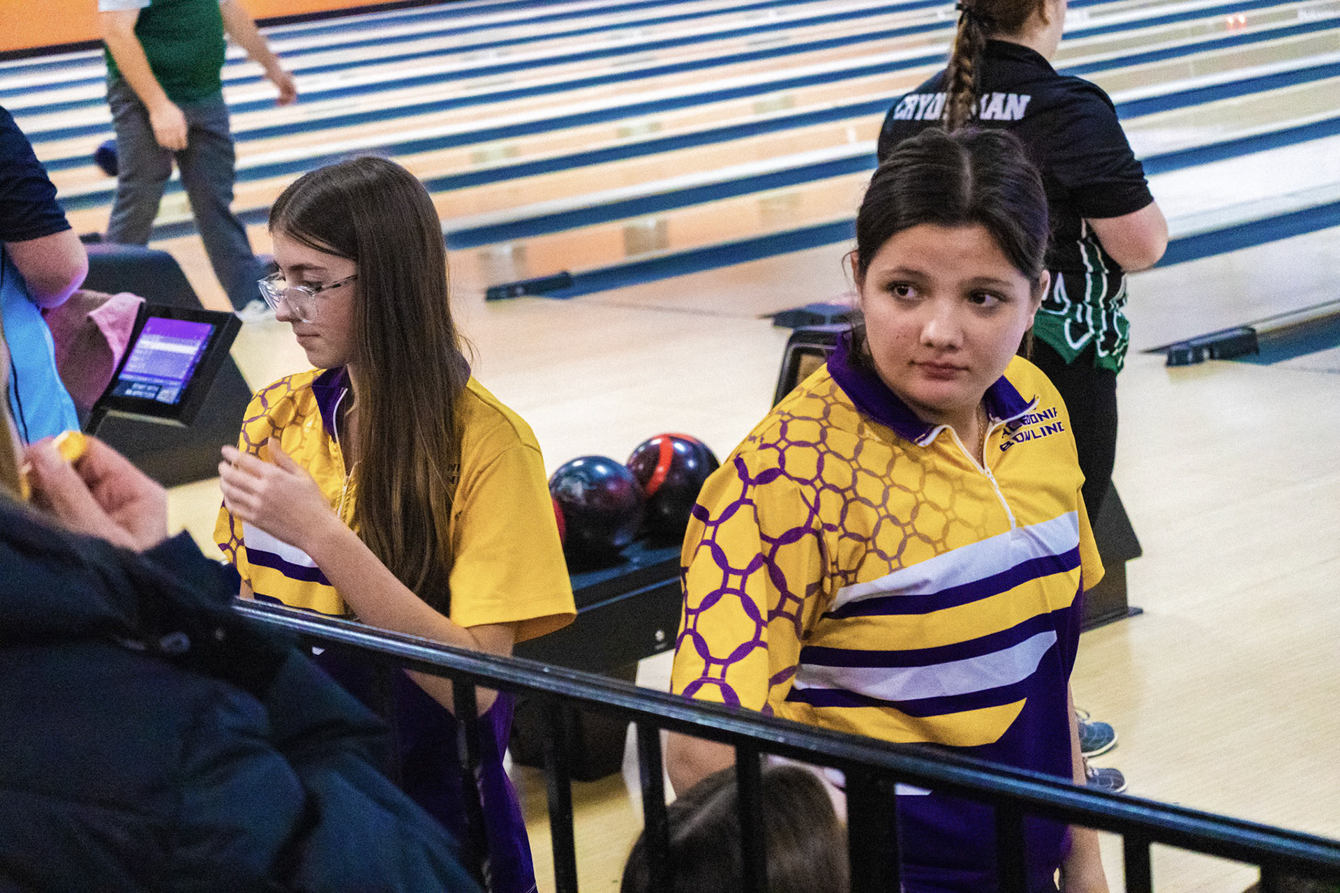 After hitting their respective bowling spots, Kacy Rosted and Kenzington Sulzener focus in, building the mindset required for a strike. (Photo by Joseph Dunn)