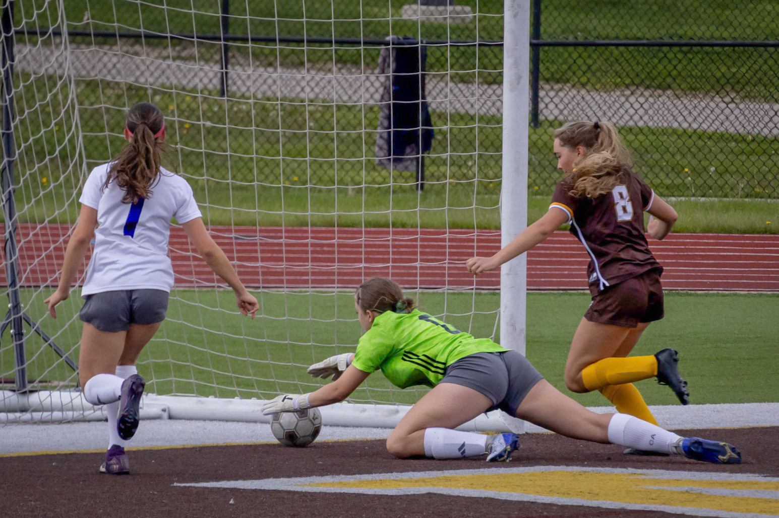 Goalie May Huckleberry makes a save to keep the ball out of the net. (Photo by Brianne Weih)