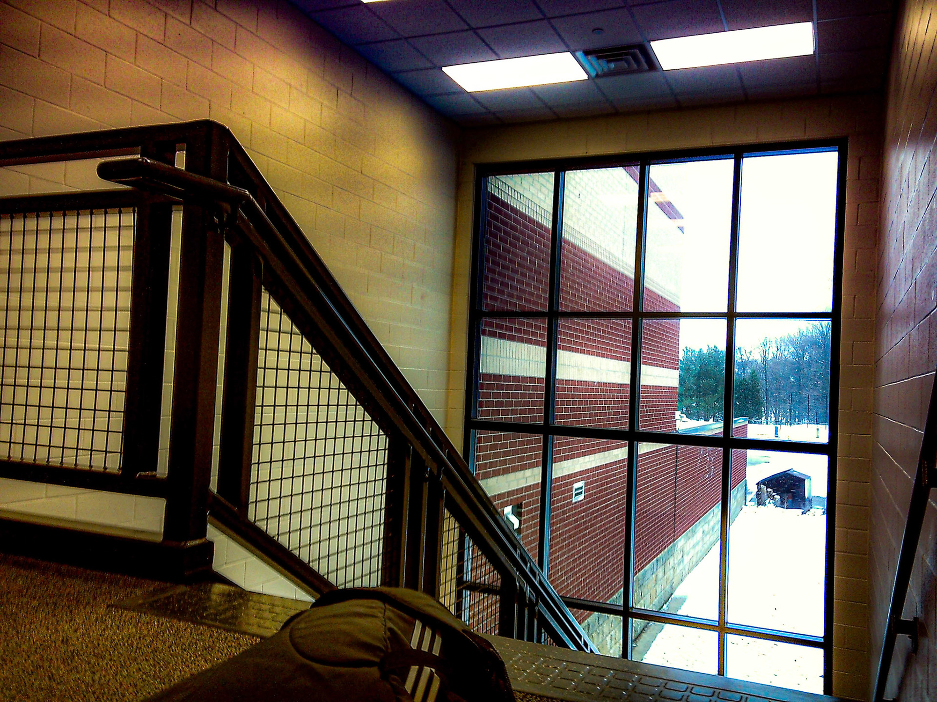 After hard hours of wrestling practice, the hot air upstairs meets the cold view of the snow. (Photo by Joseph Dunn)