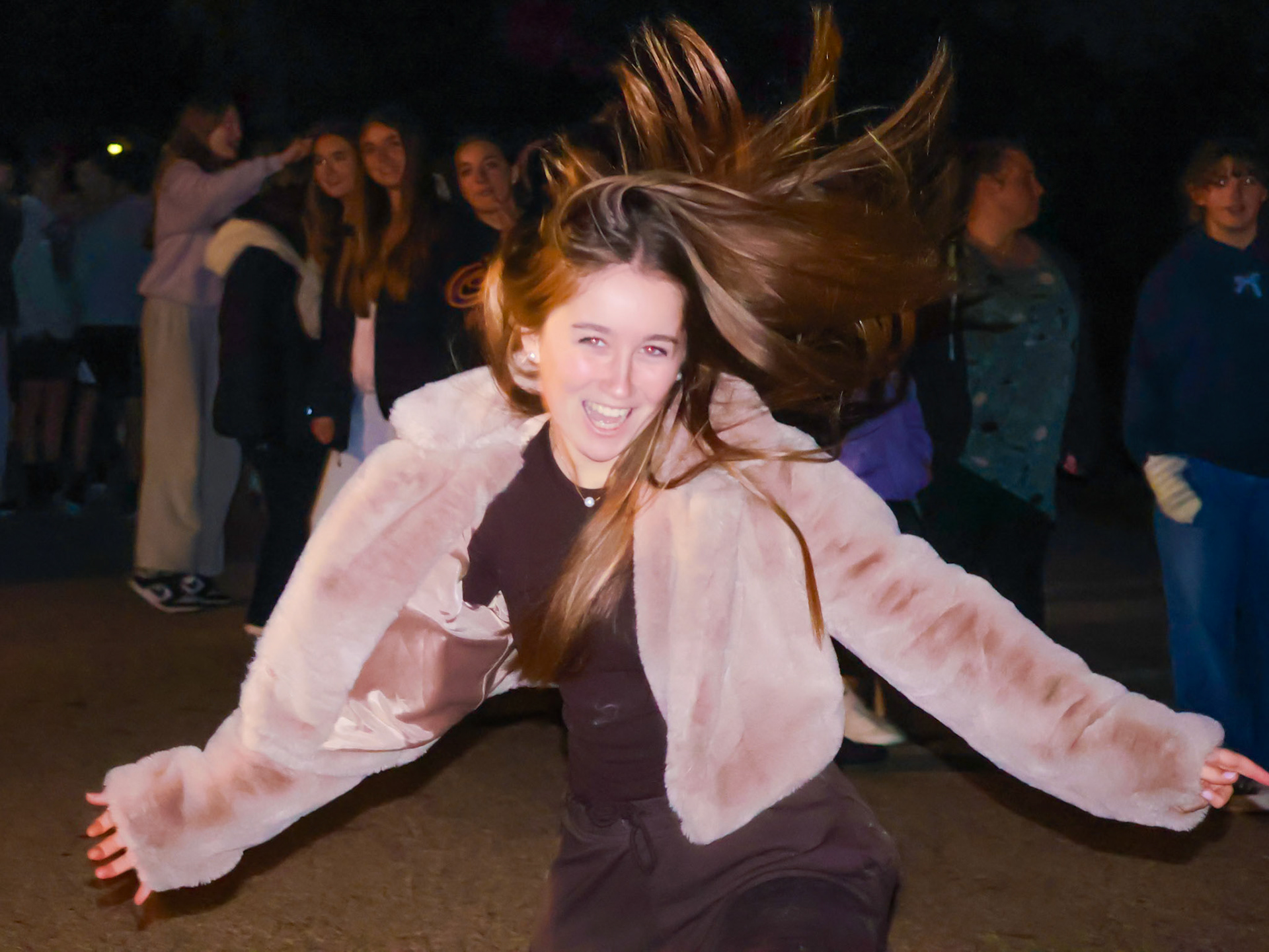 Senior Alma Cortes Diaz shows off her heel click in the line waiting to be scared at fright night. (Photo by Elsha Bytwork)