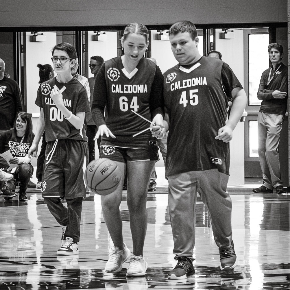 Making their way across the court to Caledonia’s side, Kortney Muller and teammate PJ Proulx prepare to take a shot. (Photo by Abby Skibinski)