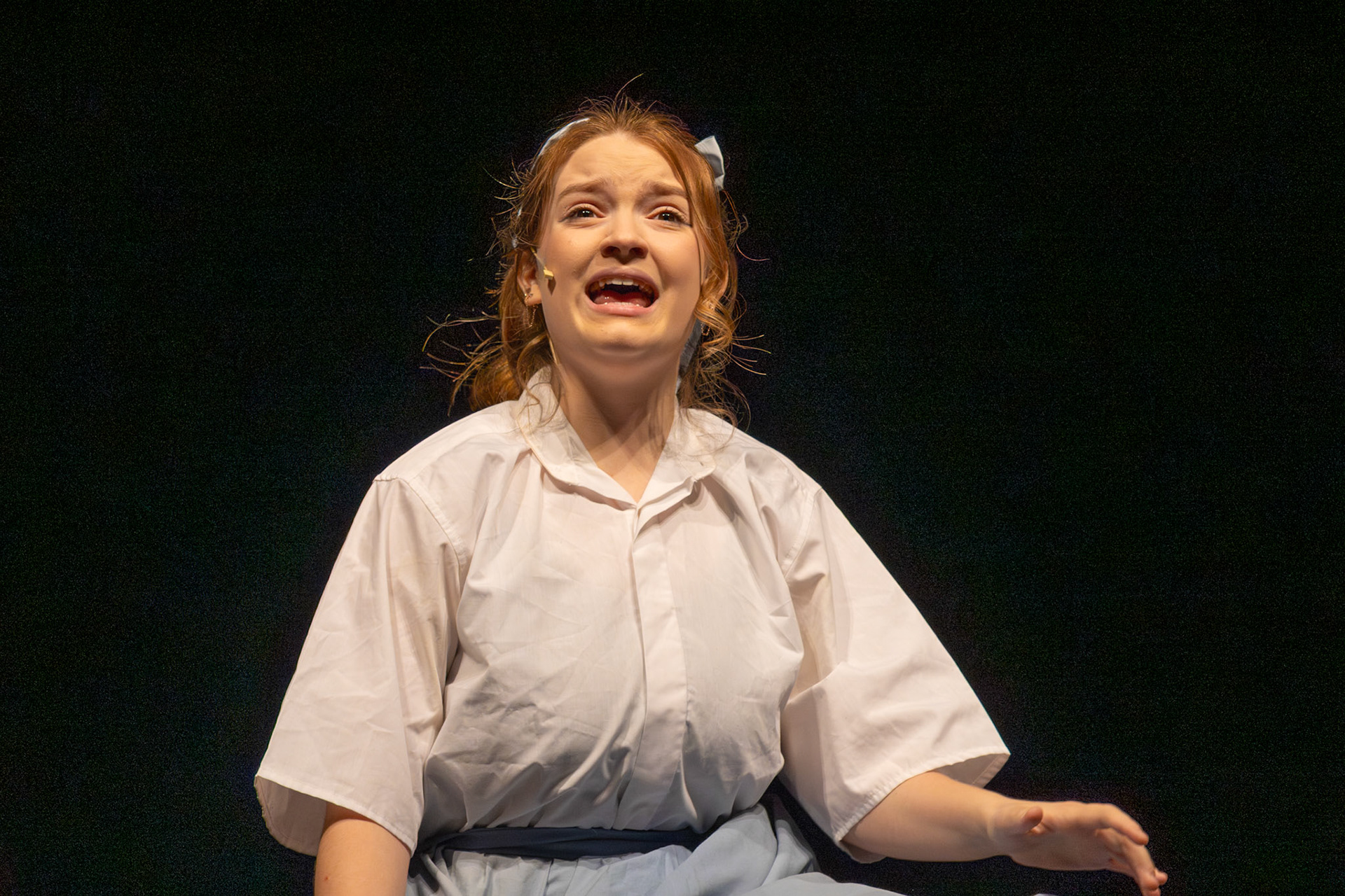 Prepare to be enchanted by Kat Jaquish's captivating performance as Cinderella in the Brothers Grimm Spectaculathon! Her talent shines brightly on stage as she pulls off the emotional side of her character. (Photo by Caralyn Price)