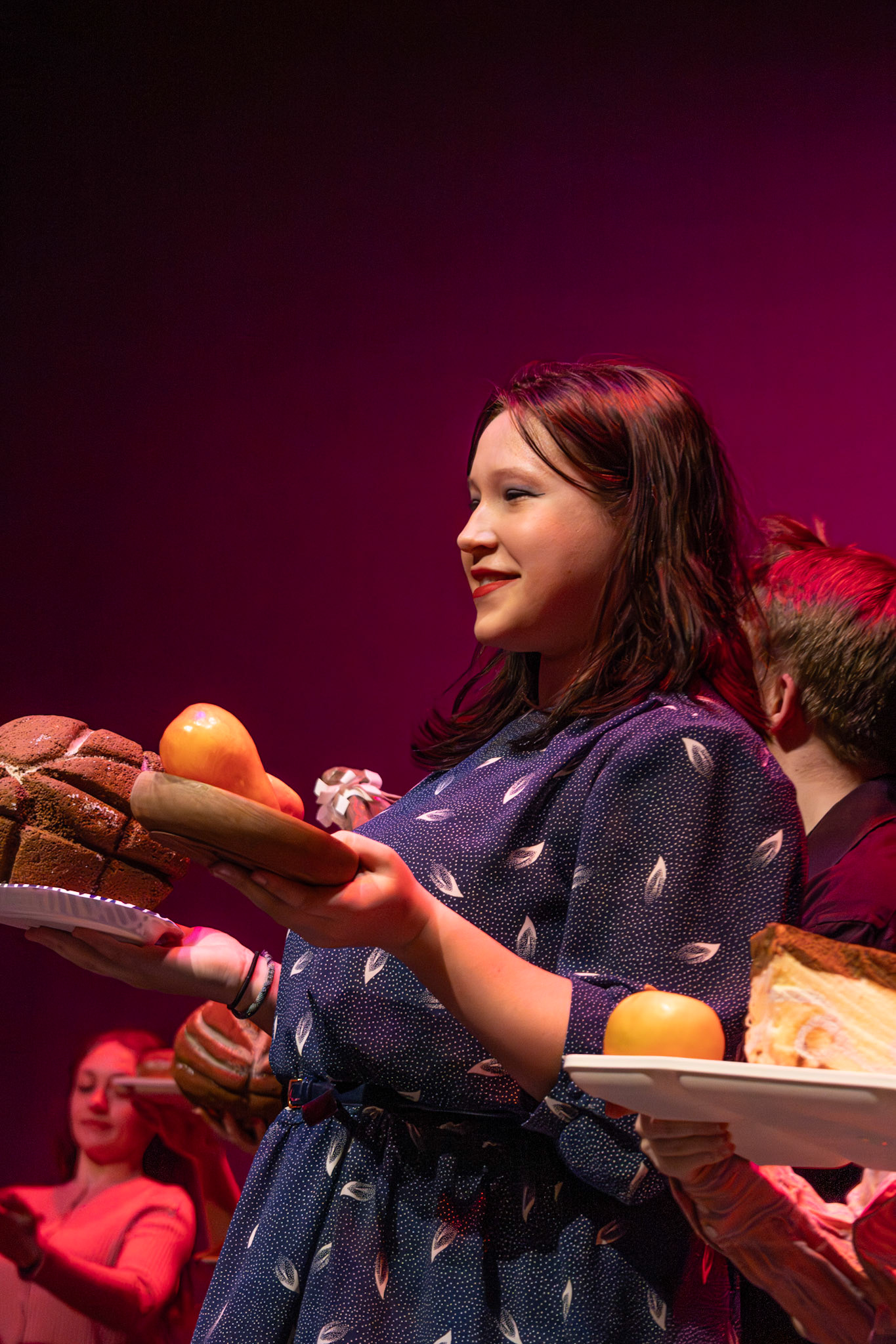 Kendall Somerville puts on a cheerful face during “I Eat More,” a food-heavy number from Willy Wonka. (Photo by Deegan Pecha-Gnat)