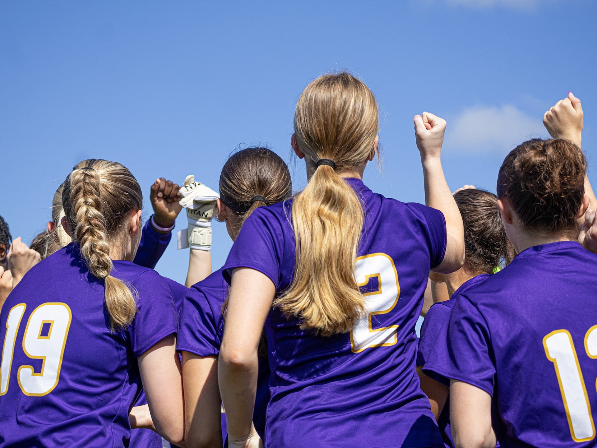 The JV team hypes each other up before the game. (Photo by Ellie VanderRoest)