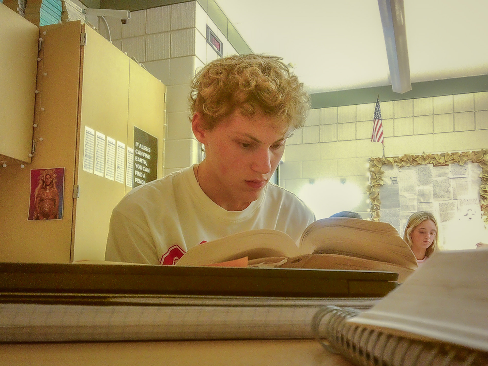 Ryan Navitskas focuses intently on the book Columbine during sacred reading time in AP Lang. (Photo by Mackenzie Popma)