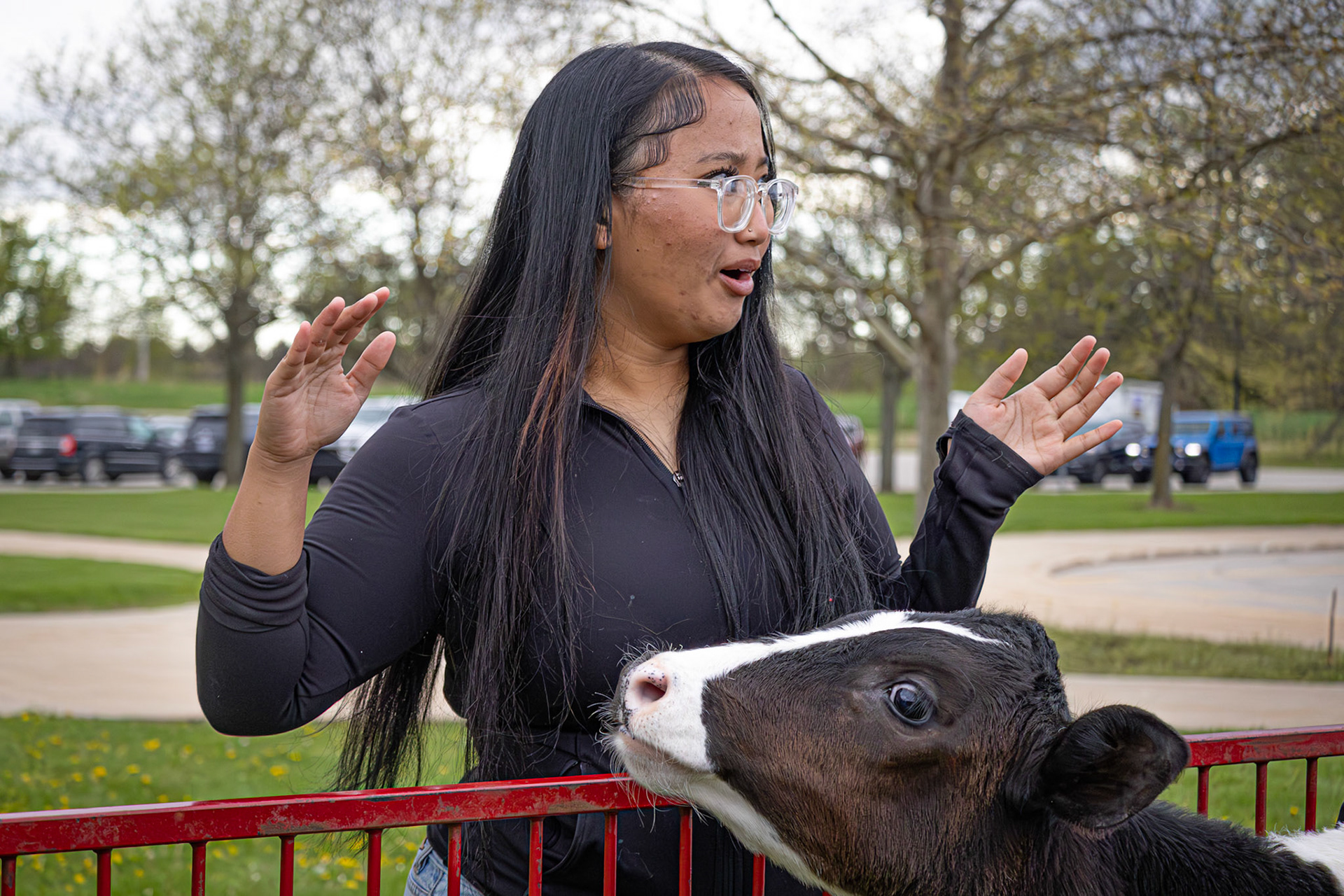 Sophomore Mimi Par makes a surprised face after a cow unexpectedly sneezed on her during the spring carnival. “It was so cool being able to see those animals during the spring carnival. The cow had sneezed on me, so I was really baffled.” (Photo by Judah Dorband)