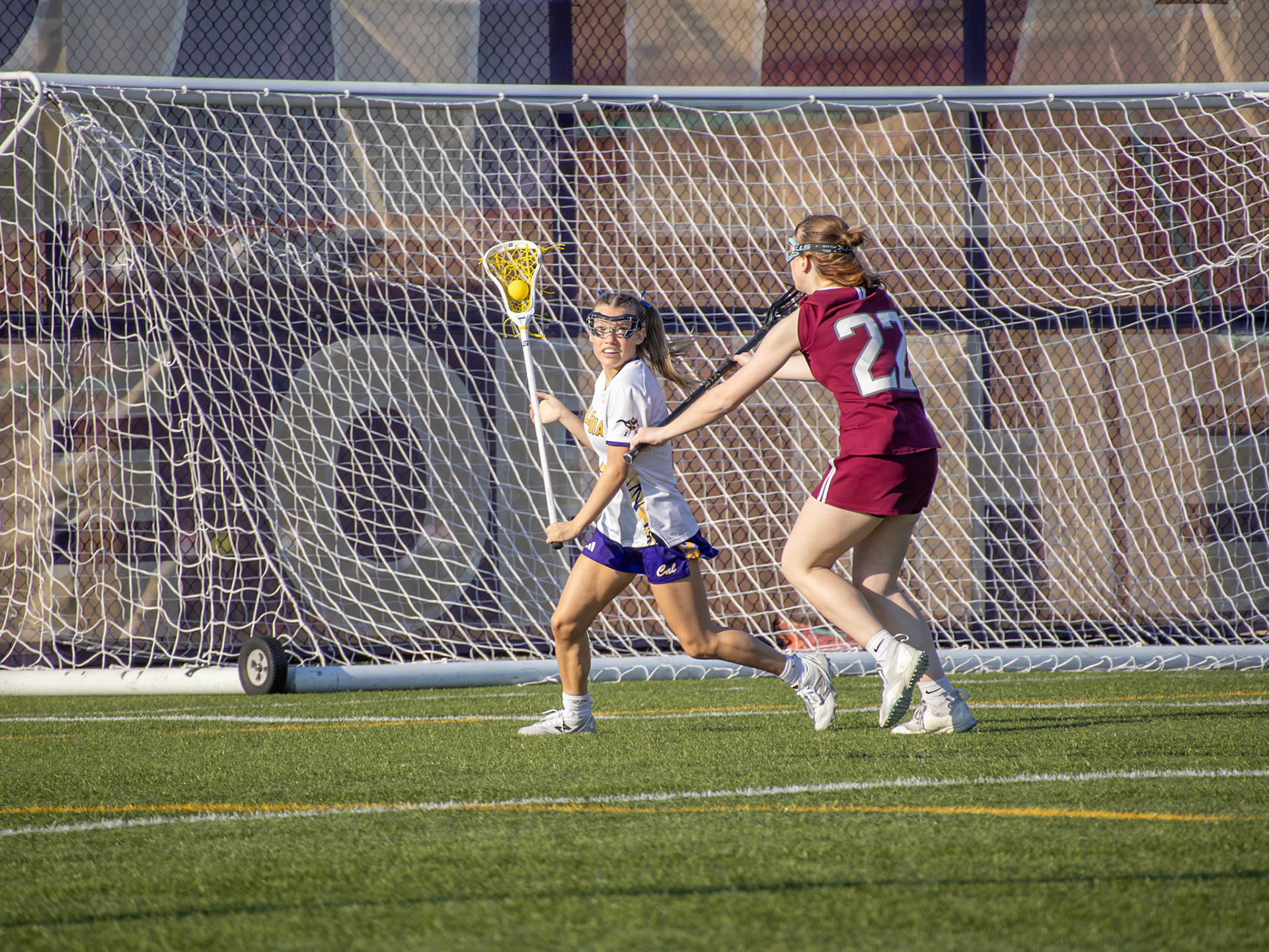 Kenzie Elmore pushes upfield from her defensive position during the lacrosse game. (Photo by Ellie VanderRoest)