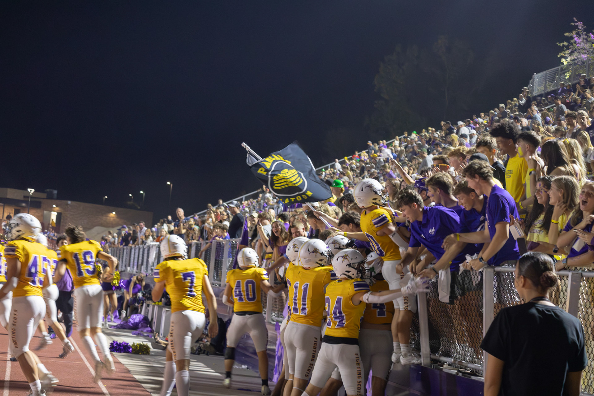 After halftime, the Fighting Scots get the crowd hyped for their sound defeat of the Buccaneers. (Photo by Milana Rico)