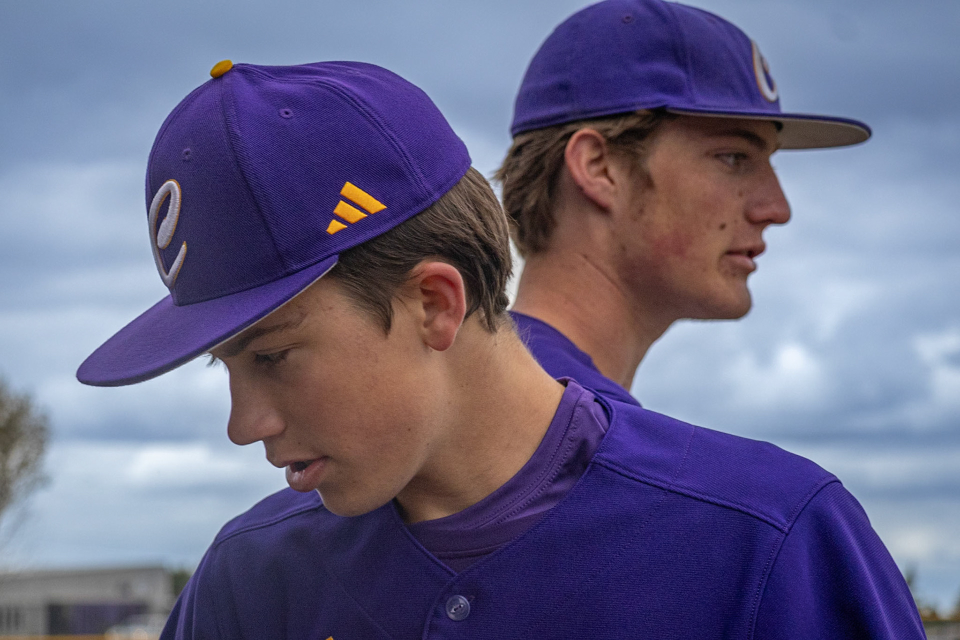 Lincoln Snow and Gavin Seabert watch the action from the dugout. (Photo by Emma Garza)