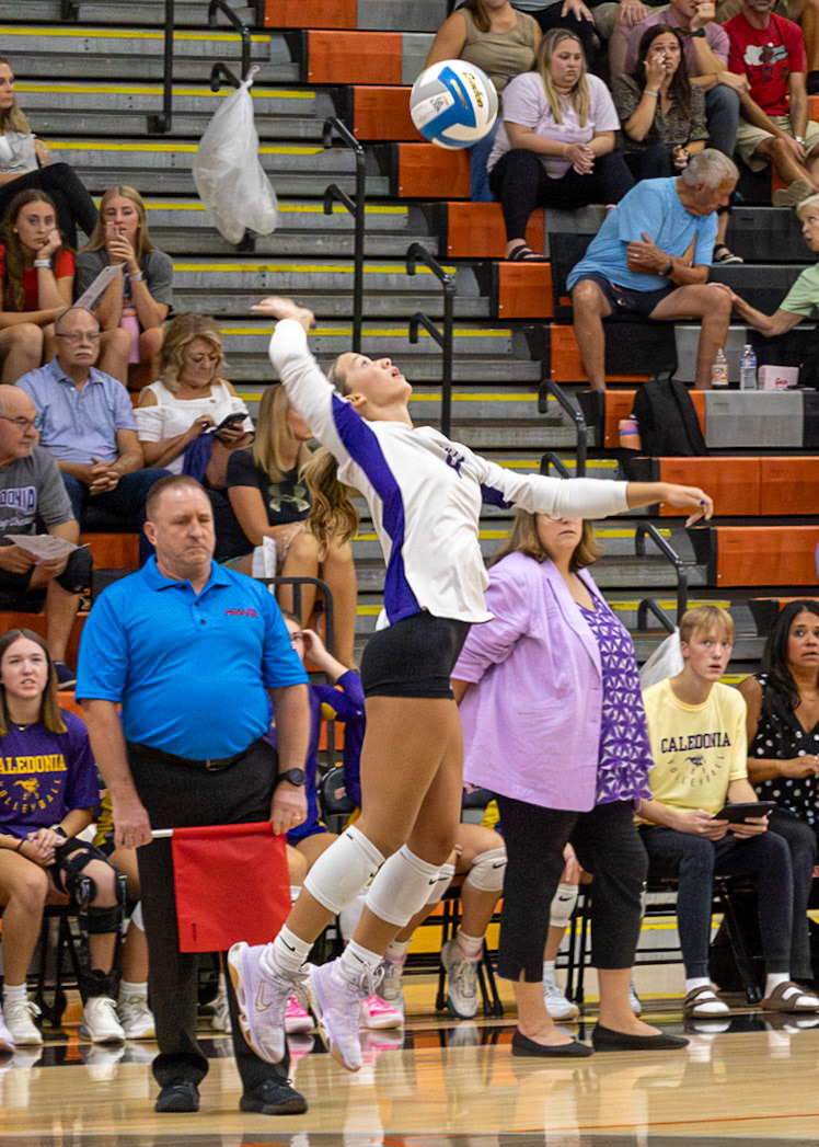 Avery Seif strikes a serve to start a point during a match.(Photo by Elsha Bytwork)